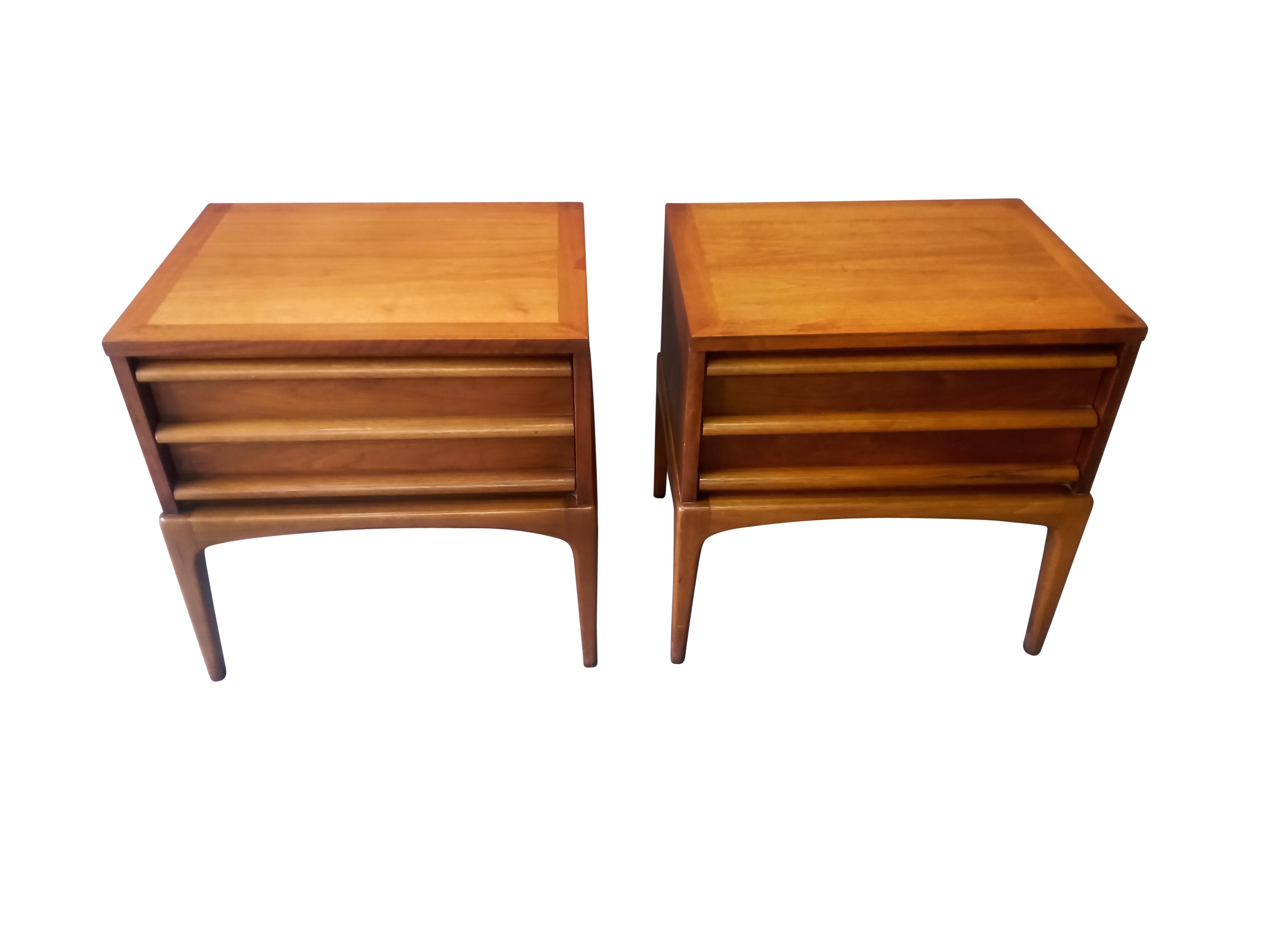 A very nice pair of American Mid-Century walnut nightstands from the 