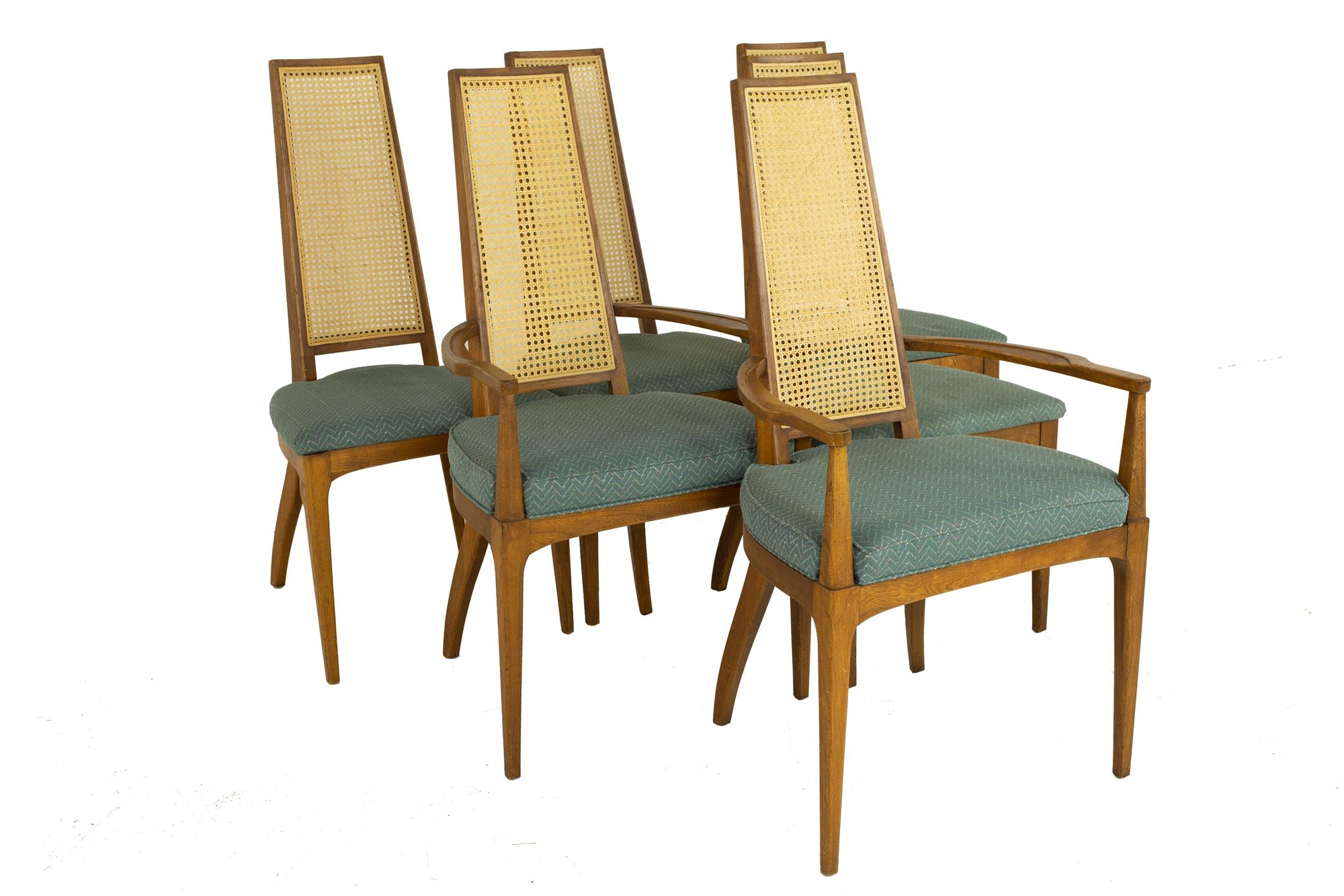 Lane Rhythm style mid century walnut and cane high back dining - chairs set of 6

Each chair measures: 22.25 wide x 23.5 deep x 41 high, with a seat height of 19 inches and arm height/chair clearance of 25 inches 

?All pieces of furniture can