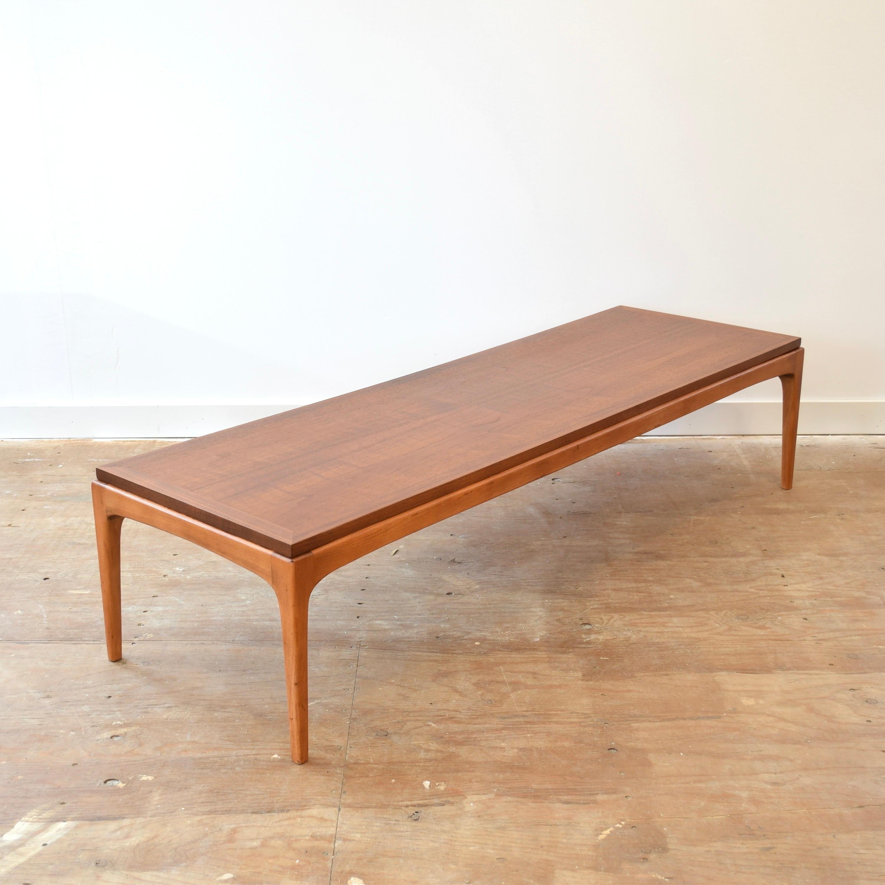 Condition: Refinished

Dimensions: 60” L x 19.5” D x 13.75” H

Description: A vintage walnut coffee table. Made in Canada, circa 1960s-70s. Designed by Lane and manufactured under license in Canada by Knetchel. Part of the Lane Rhythm line. 