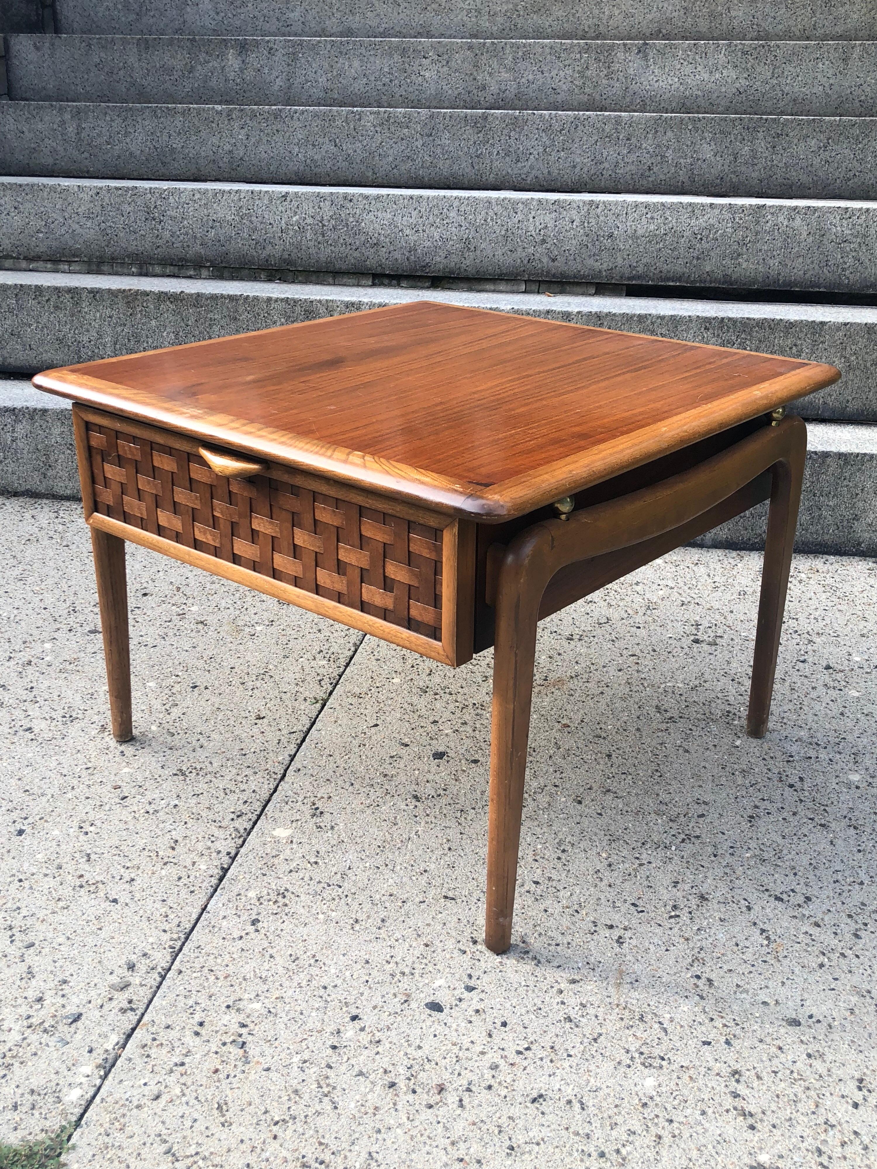 Lane cocktail or coffee table in solid walnut. In very good original condition. Great color and grain detail. Signed on underside of drawer.
