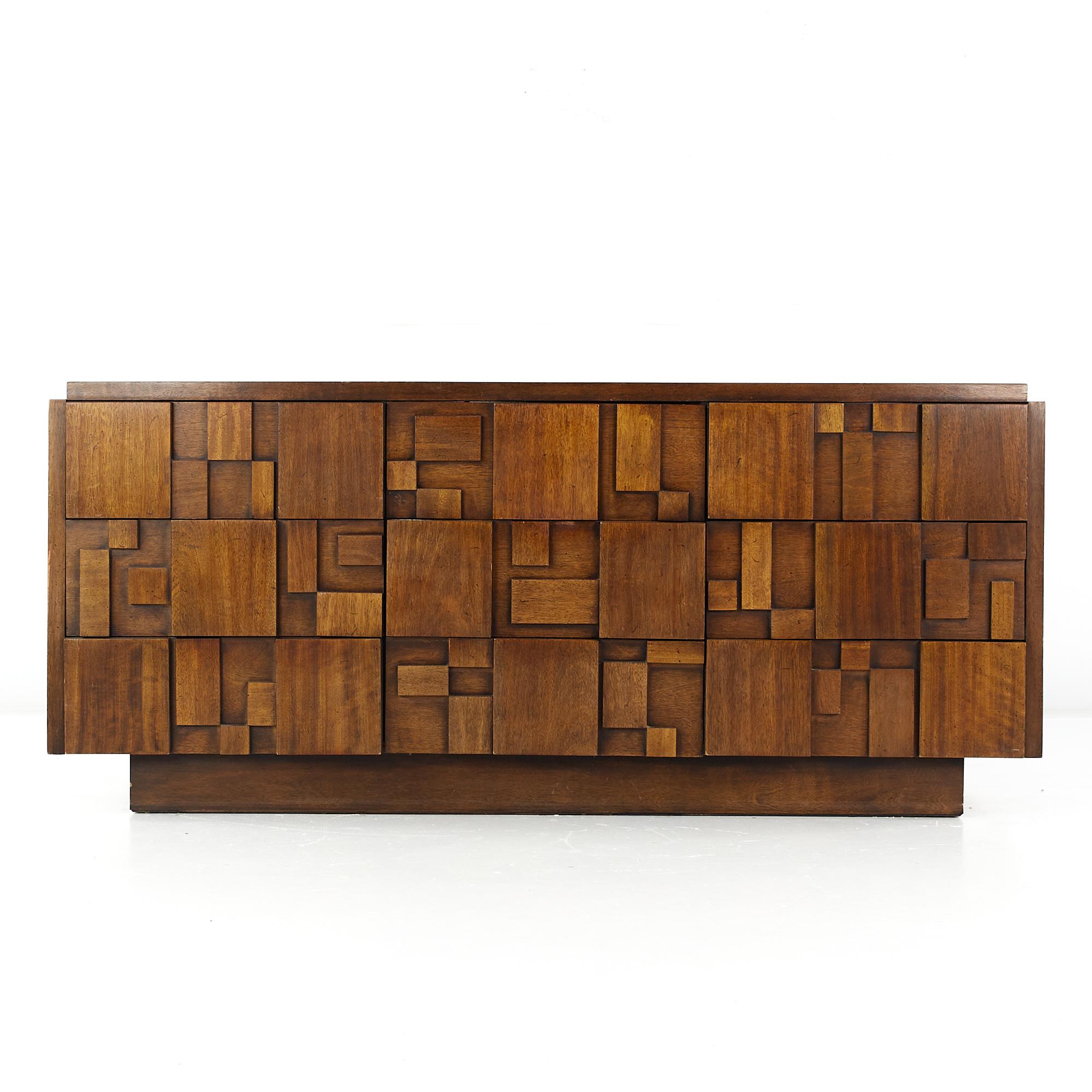 Lane Staccato Brutalist mid century walnut lowboy dresser

This lowboy measures: 68.5 wide x 18.75 deep x 30.25 inches high

All pieces of furniture can be had in what we call restored vintage condition. That means the piece is restored upon