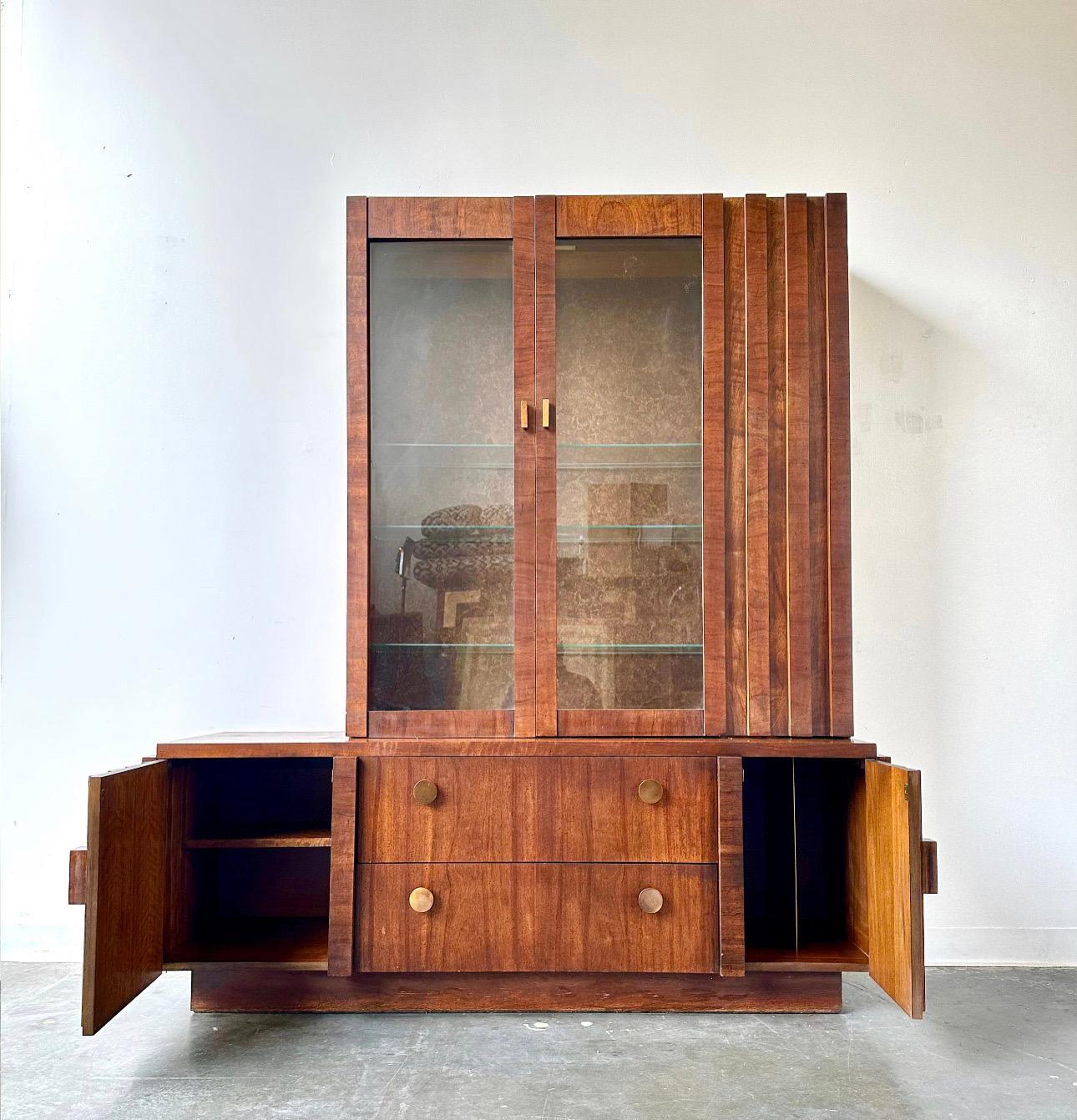 Lane furniture company 

Paul Evans inspired brutalist style two piece china cabinet.

Stunning walnut piece with great lines and design.    This is in great vintage condition with minor signs of age appropriate wear.

Dimensions:
66” W x 19” D x