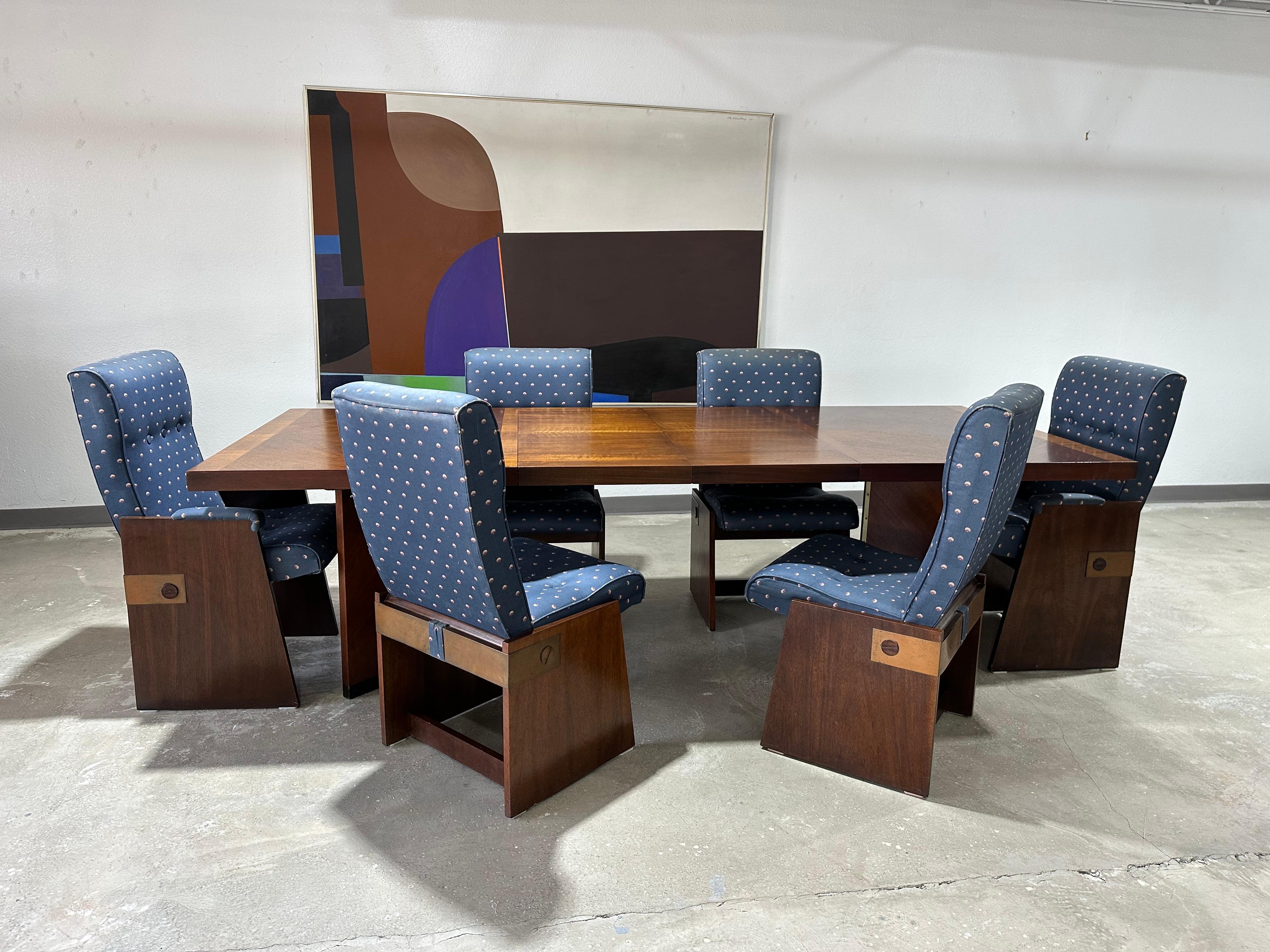 Vintage Mid Century Lane Staccato Dining Set circa 1970’s. Walnut parquetry top dining table that extends with two leaves (not self stowed), rests on triangular hinged legs which can be removed and folded for transport. Accompanied by a set of 6