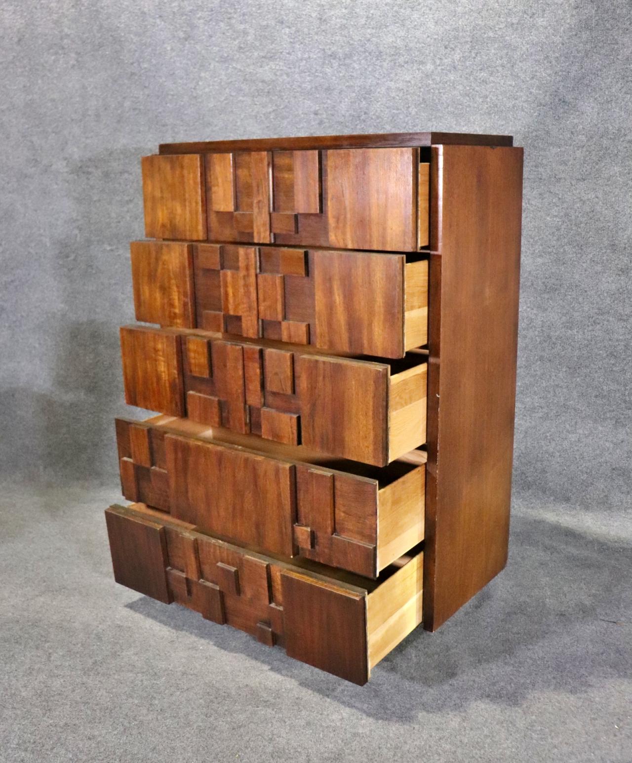 Mid-century modern tall dresser by Lane Furniture for their 'Staccato' series. Featuring five wide and deep drawers with a mosaic wood patchwork design.
Please confirm location NY or NJ