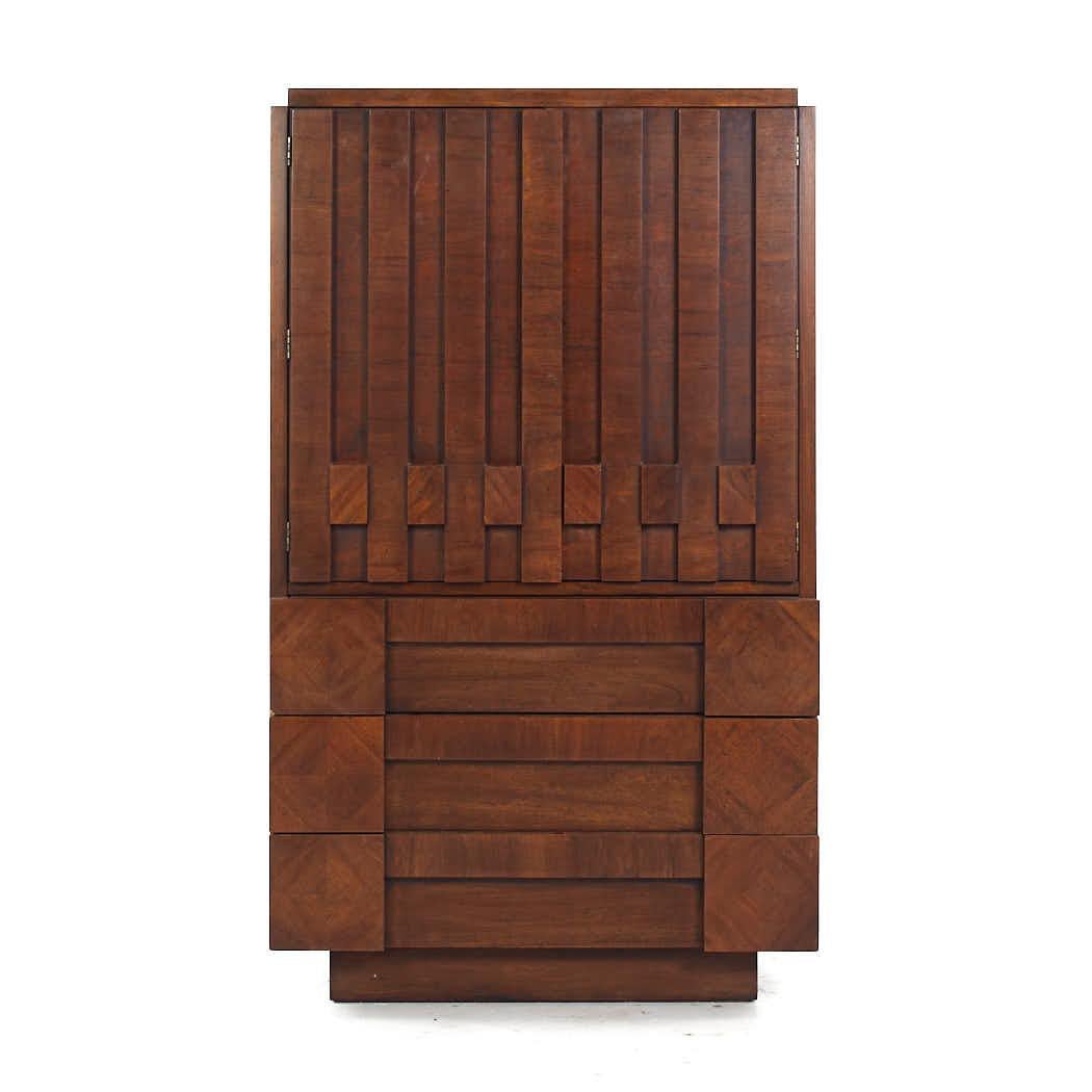 Lane Staccato Mid Century Walnut Brutalist Armoire Dresser

This armoire measures: 38 wide x 19.25 deep x 64 inches high

All pieces of furniture can be had in what we call restored vintage condition. That means the piece is restored upon purchase