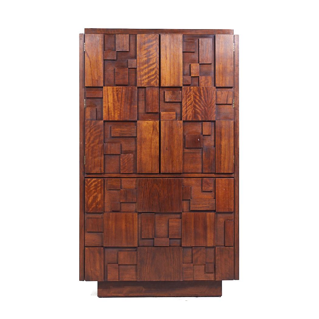 Lane Staccato Mid Century Walnut Brutalist Armoire

This armoire measures: 38 wide x 18.75 deep x 64.25 inches high

All pieces of furniture can be had in what we call restored vintage condition. That means the piece is restored upon purchase so