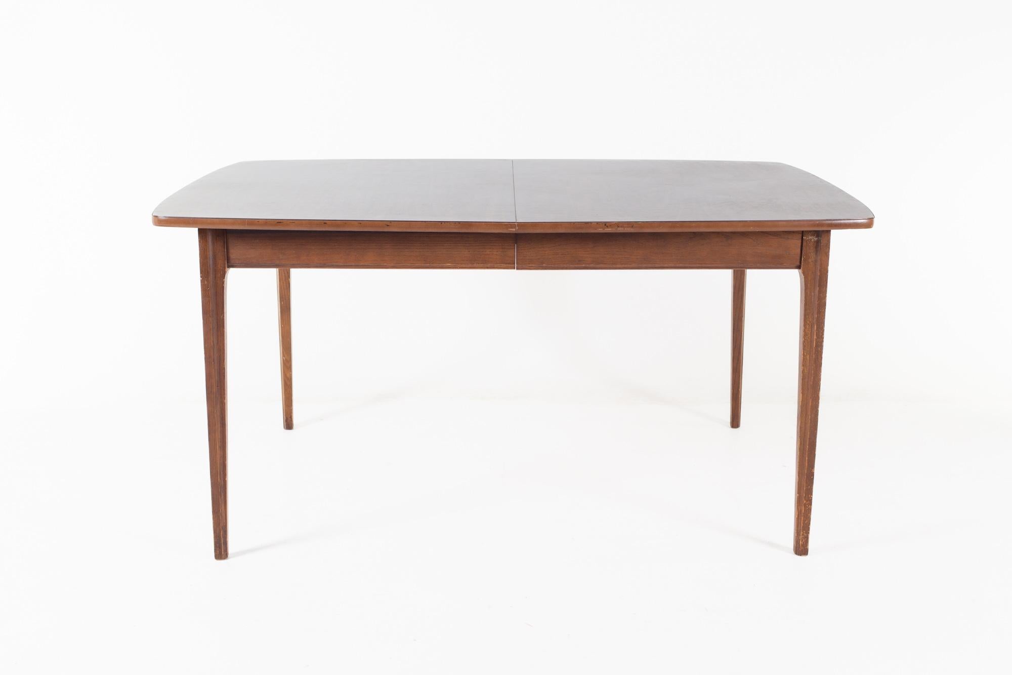 Lane style mid century laminate top dining table

The table measures: 60 wide x 40 deep x 29 high, with a chair clearance of 25 inches 

All pieces of furniture can be had in what we call restored vintage condition. That means the piece is