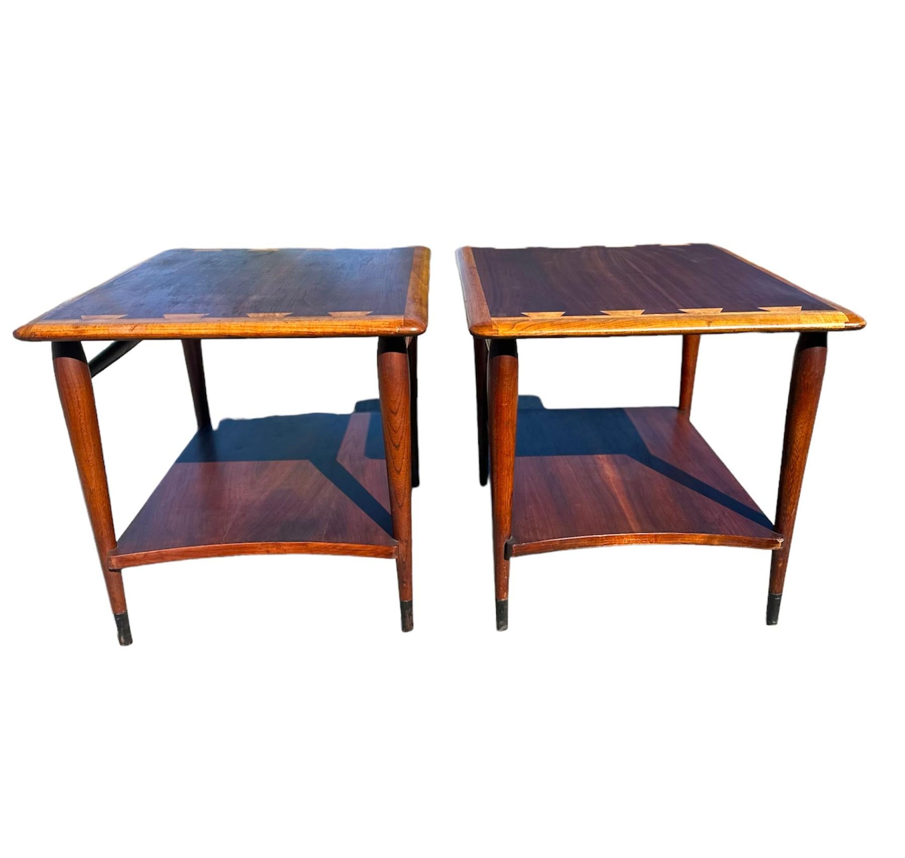 Mid Century Modern end tables by Andre Bus Model Number 900- 05. Very sturdy set and the dovetail makes for a fantastic two tone design feature., The legs are tapered and capped in metal.