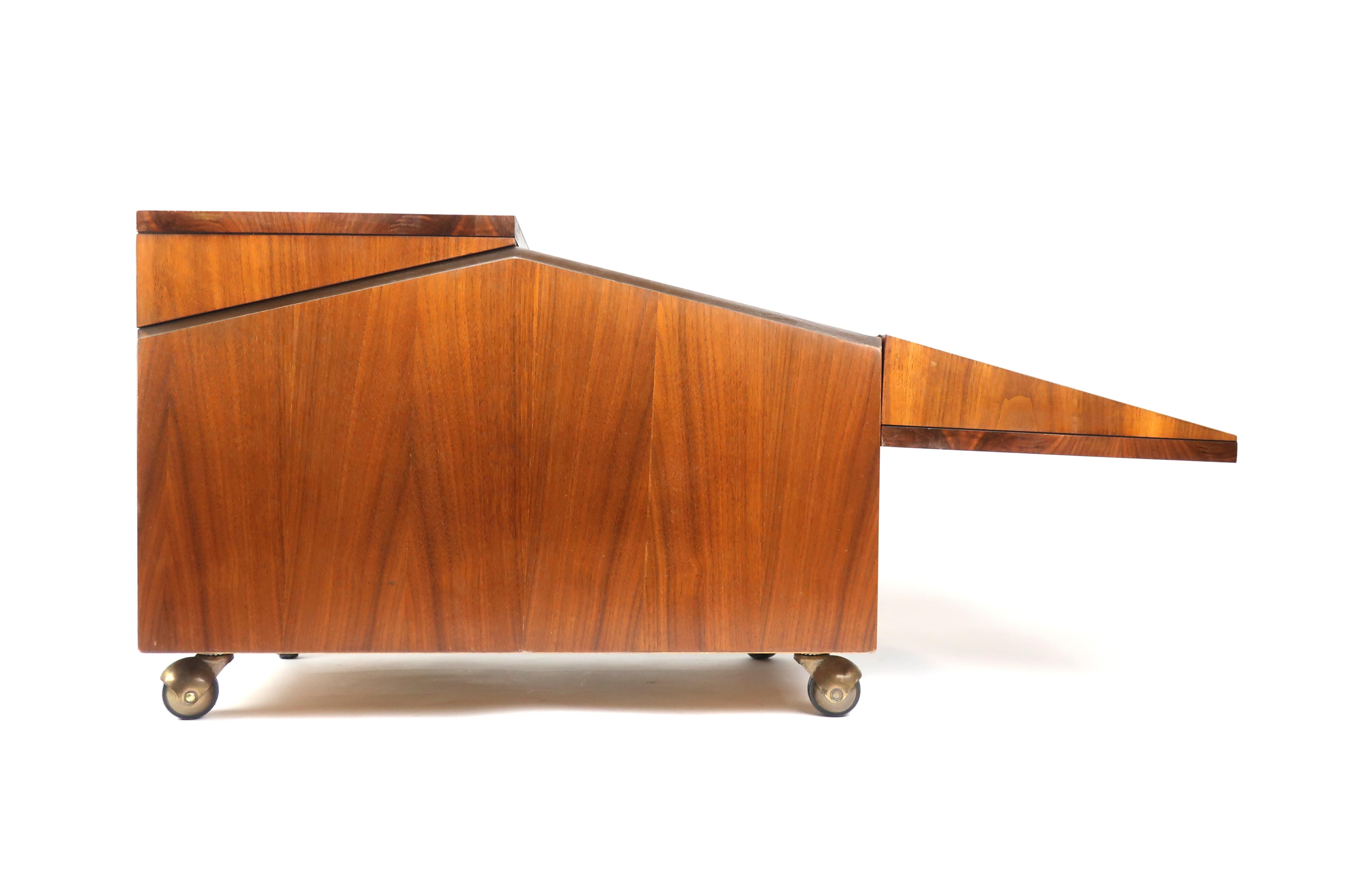 Lane walnut record storage chest or cabinet.

Gorgeous vintage walnut Lane record chest. The top opens with two hinged lids to expose the storage inside. Designed for record storage but perfect for books or anything you want to keep pets, kids, or