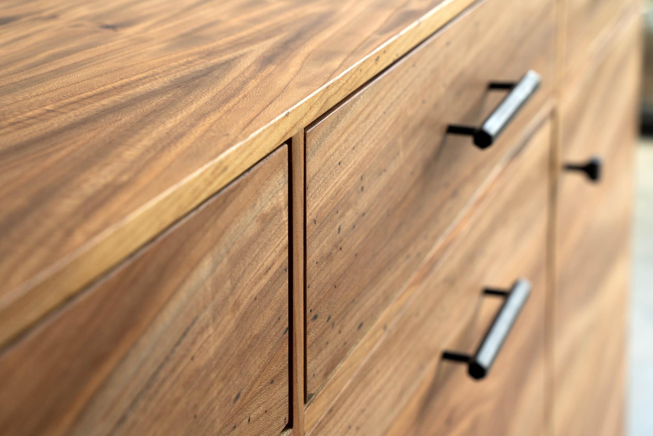 The Lanett credenza is handcrafted and unique in every way. The elegance of this modern style credenza strikes from the first moment with intricate veneer work showcasing the enigmatic grain patterns of urban timber. Unique species like elm ensure