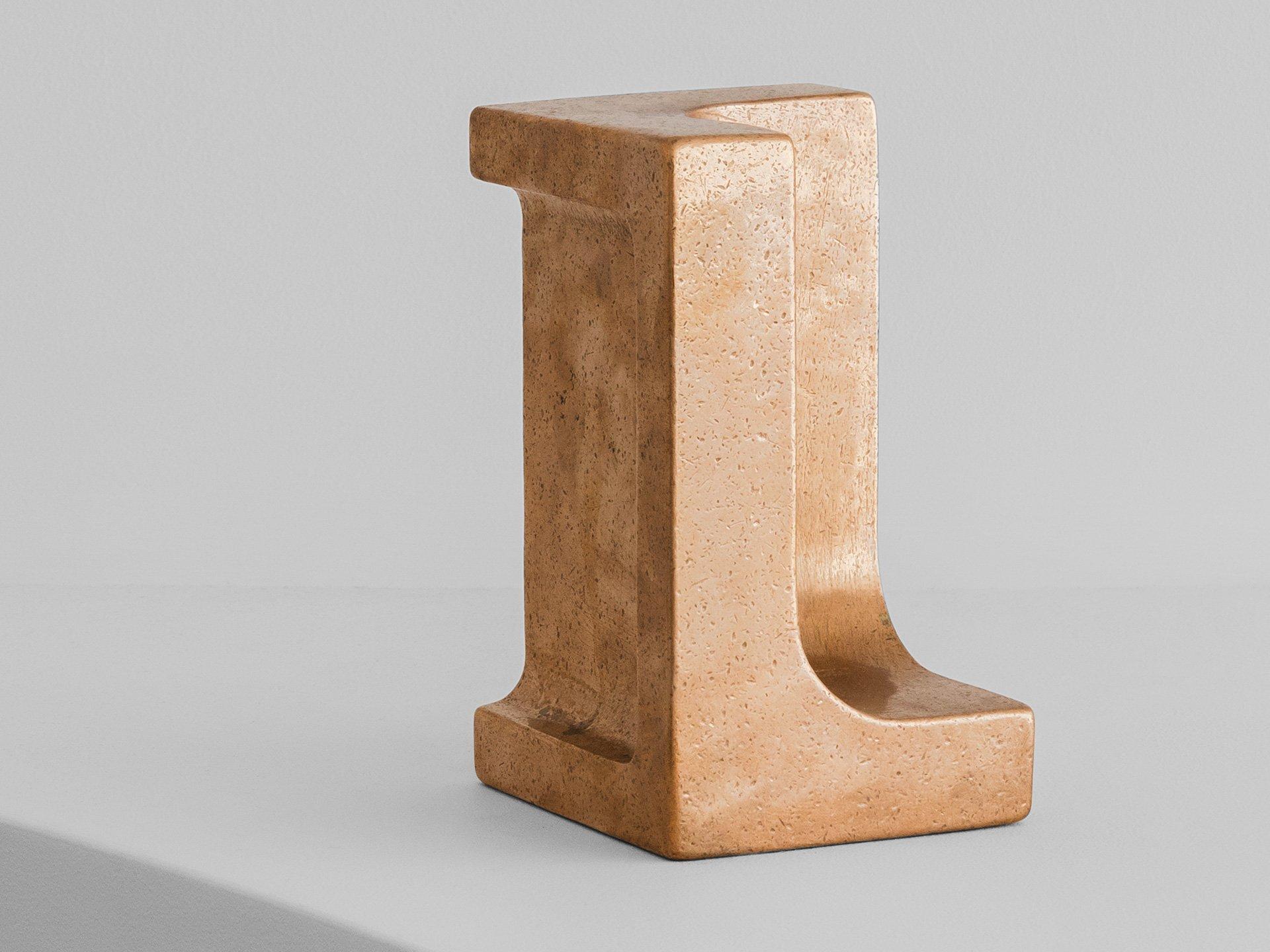 Langley Bookend by Henry Wilson
Dimensions: W 11 x D 10 x H 17 cm
Materials: Sand-cast Gunmetal bronze

Langley Bookend is part modernist sculpture part functional shelf accessory. It is big and bold, comes in a single size and weighs a hefty 10kg.