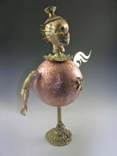 "Joker, " metal and clay doll-like figure with gold head, copper body