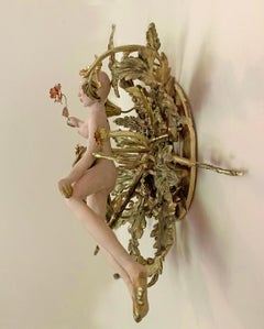 "Queen for a Day" floats a pink nude over golden ornaments
