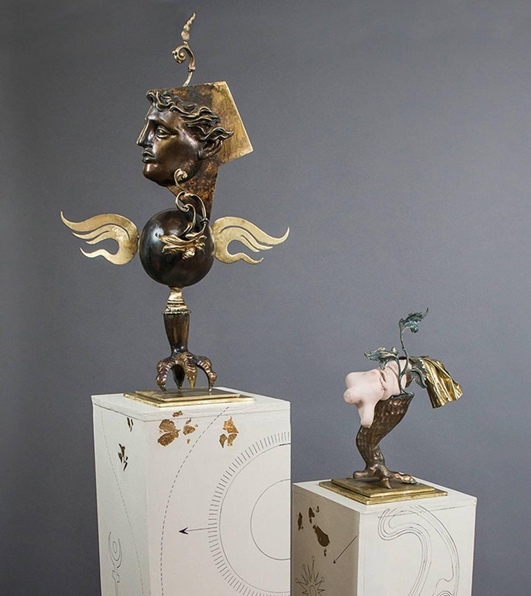 Lannie Hart Figurative Sculpture - "The Lovers", gold and bronze colored figures, stand on paired pedestals 
