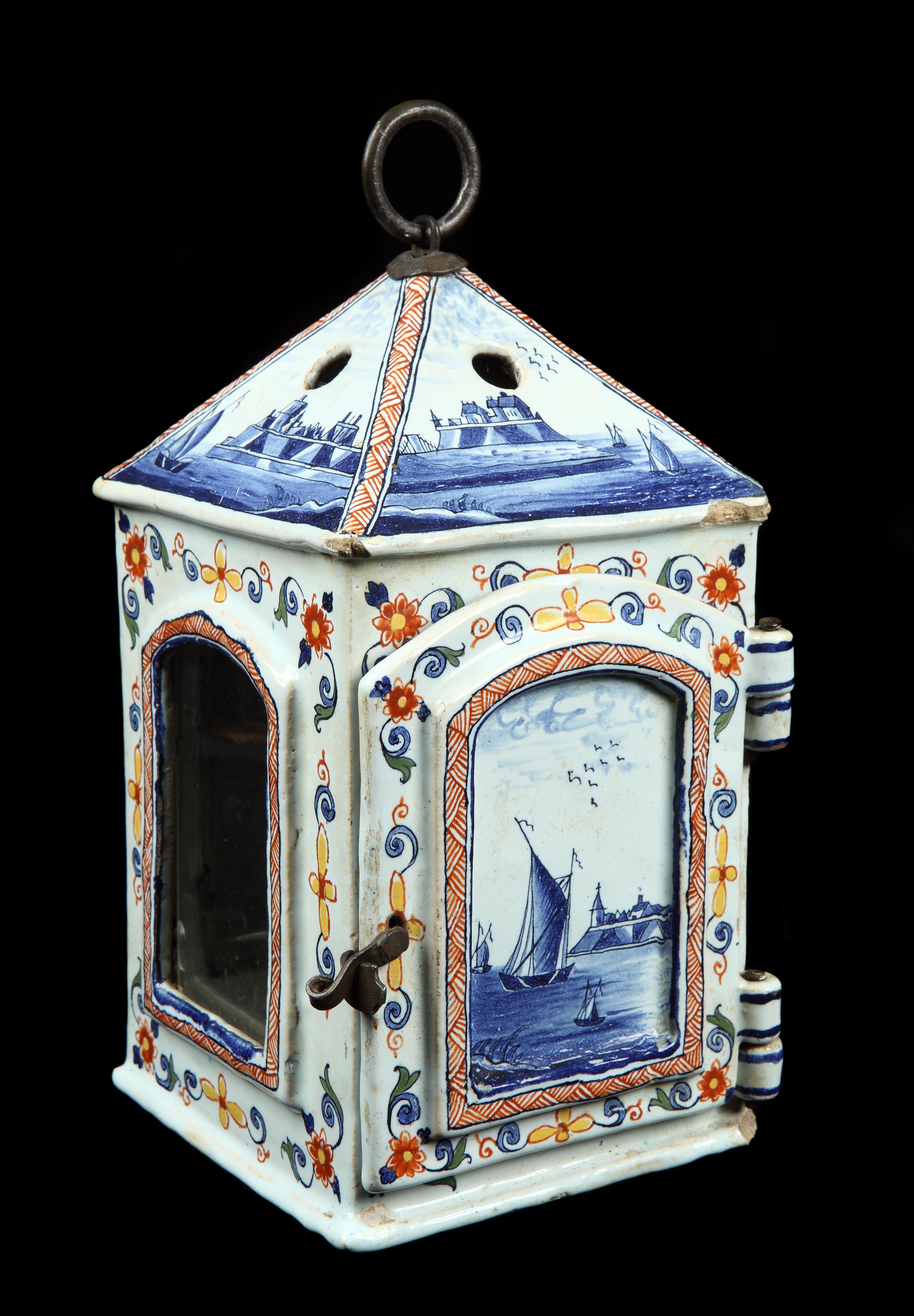 This charming lantern decorated with typical Dutch estuary scenes is a rare survival.  Although they must have been made in large quantities as evidenced in many Dutch Old Masters their medium makes them very vulnerable.  The painting on this