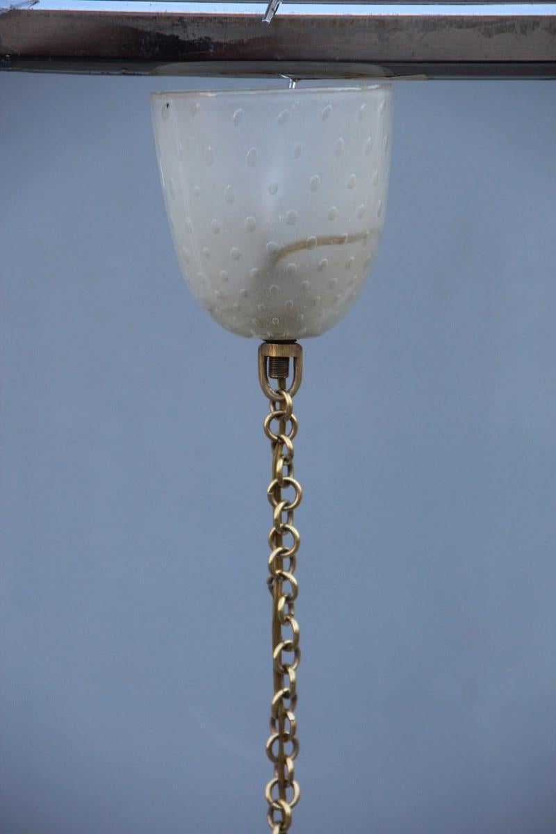 Lantern Murano glass bell midcentury Italian design Trasparent bubbles, Barovier attributed, brass chain.
1 light bulb E27 Max 80 Watt.
Only glass bell height cm.45 diameter cm.29
Elegant piece.
