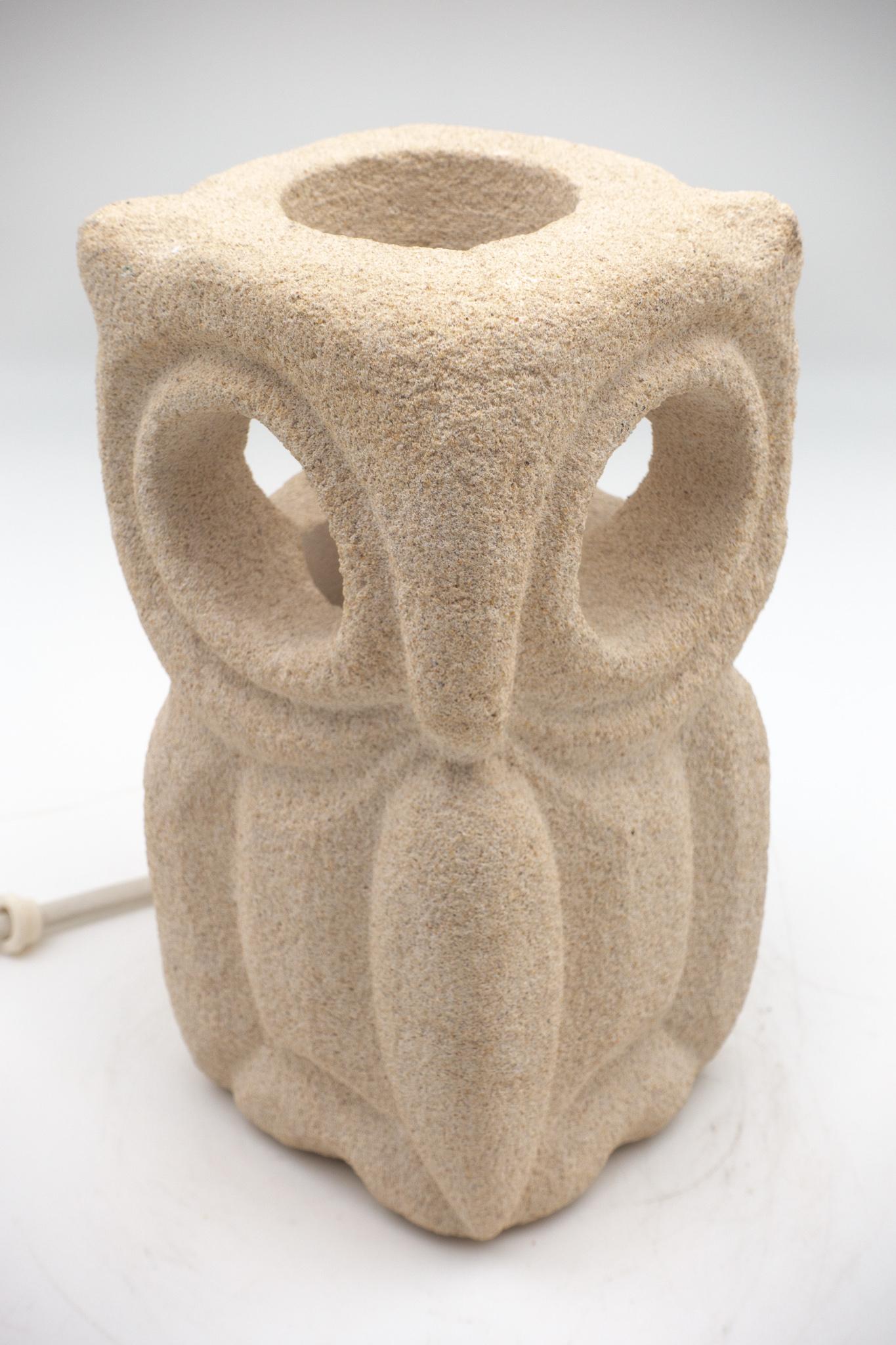 Lantern owl lamp sculpted in limestone by Albert Tormos in France during the 1970s. The lamp is electrified, the bulb being within the carved owl allowing the light to emanate from the eyes.