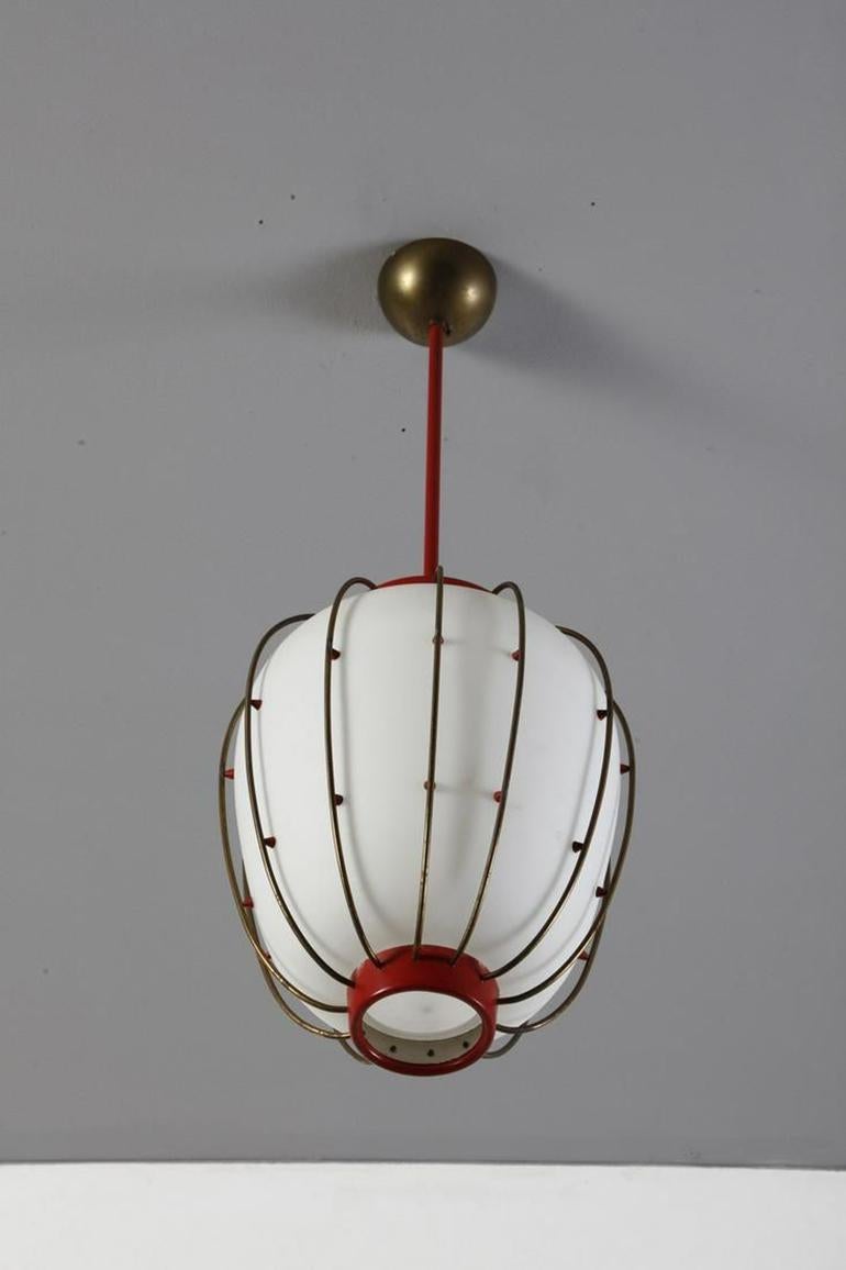 Opaline Glass Pendant Lantern designed by Angelo Lelii. 

This iconic lantern is a clear example of Angelo Lelii's mastery of scale, proportion and detailing. The gently arced brass ribs are separated from the opaline shade by tiny red cones. The