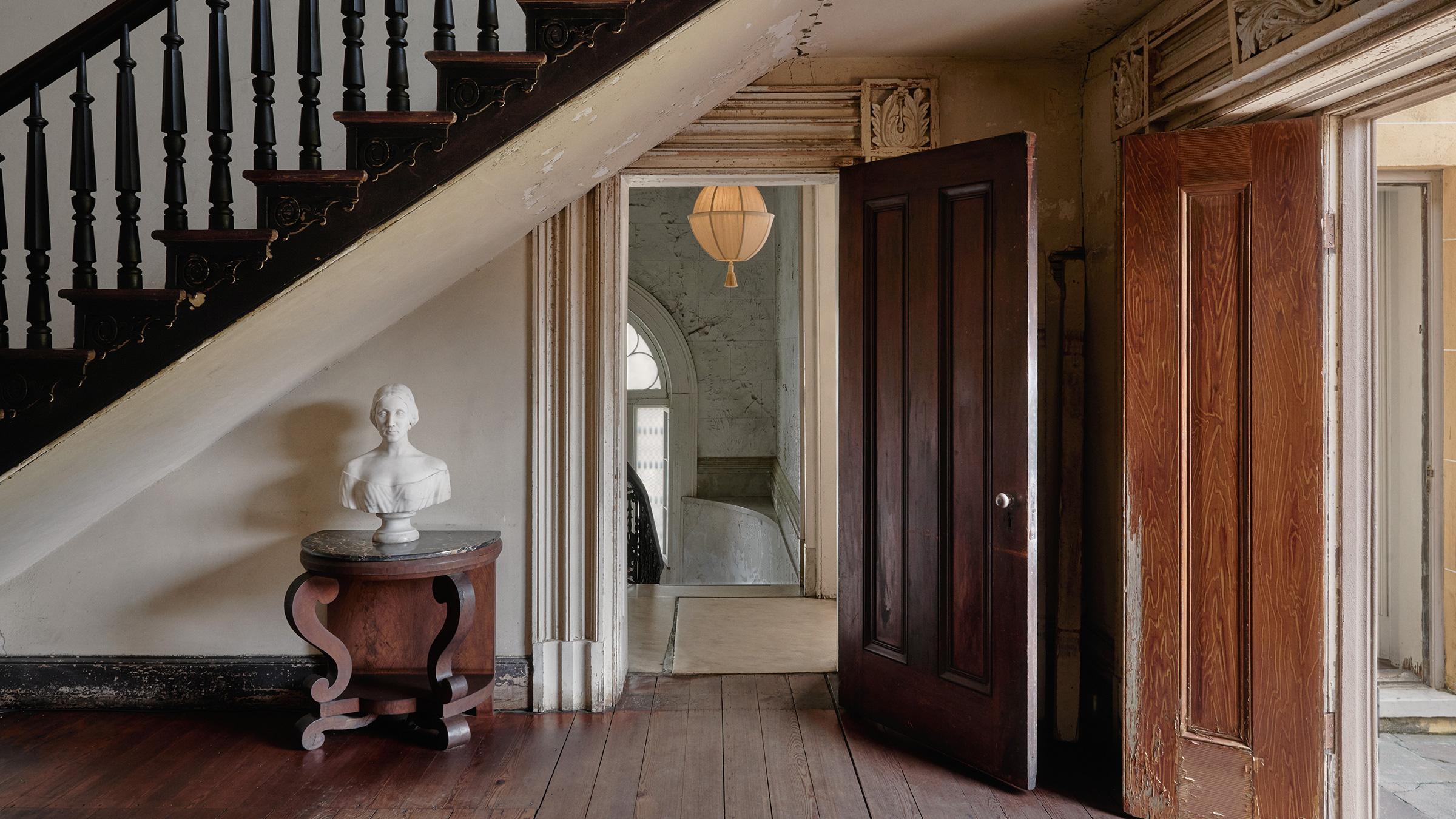 The LANTERN PENDANT SMALL brings sculptural elegance and quiet drama to any space. Crafted in the U.S. and wrapped in luminous 100% Dupioni Raw Silk, it radiates a warm, ambient glow that enriches interiors with softness and sophistication.