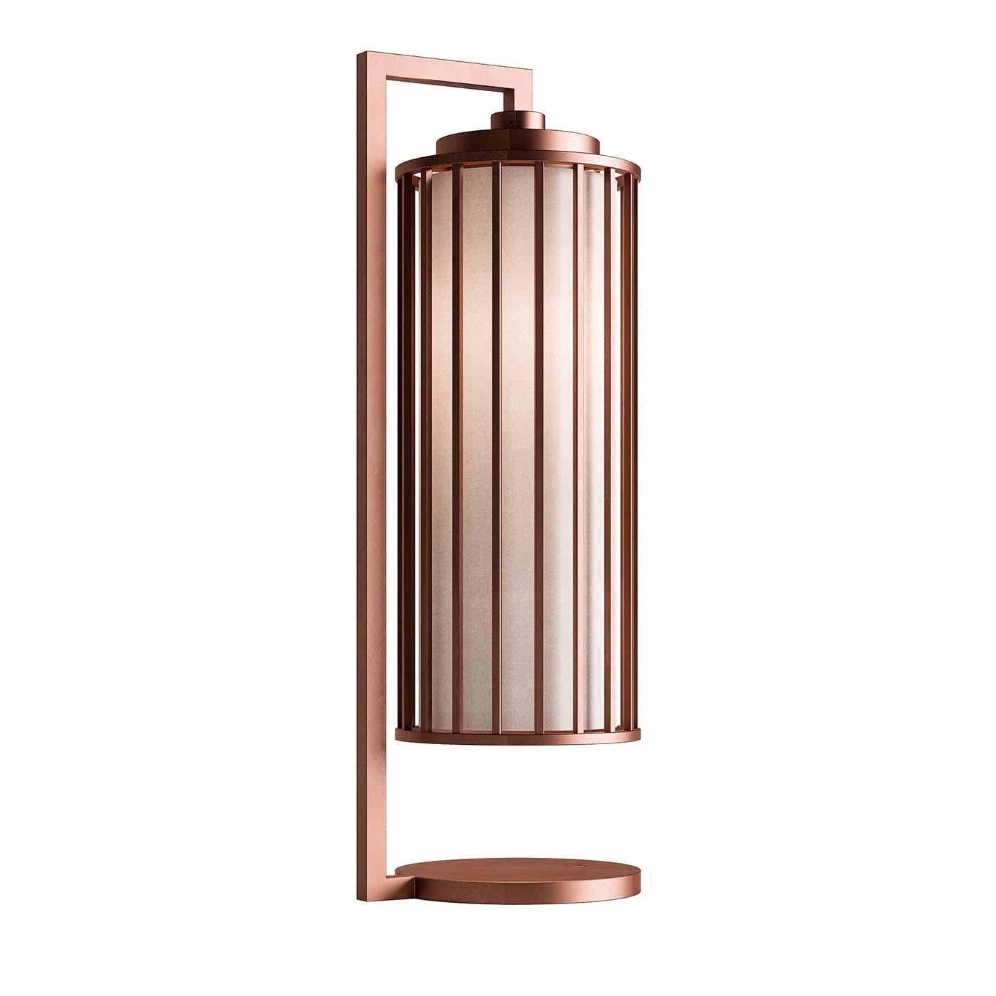 Fusing fashion with function, this table lamp will bring modern style to any room, while diffusing ambient light with its clean-lined silhouette. Crafted of metal with an alluring brushed-copper finish, this exquisite lamp has a flat round base with