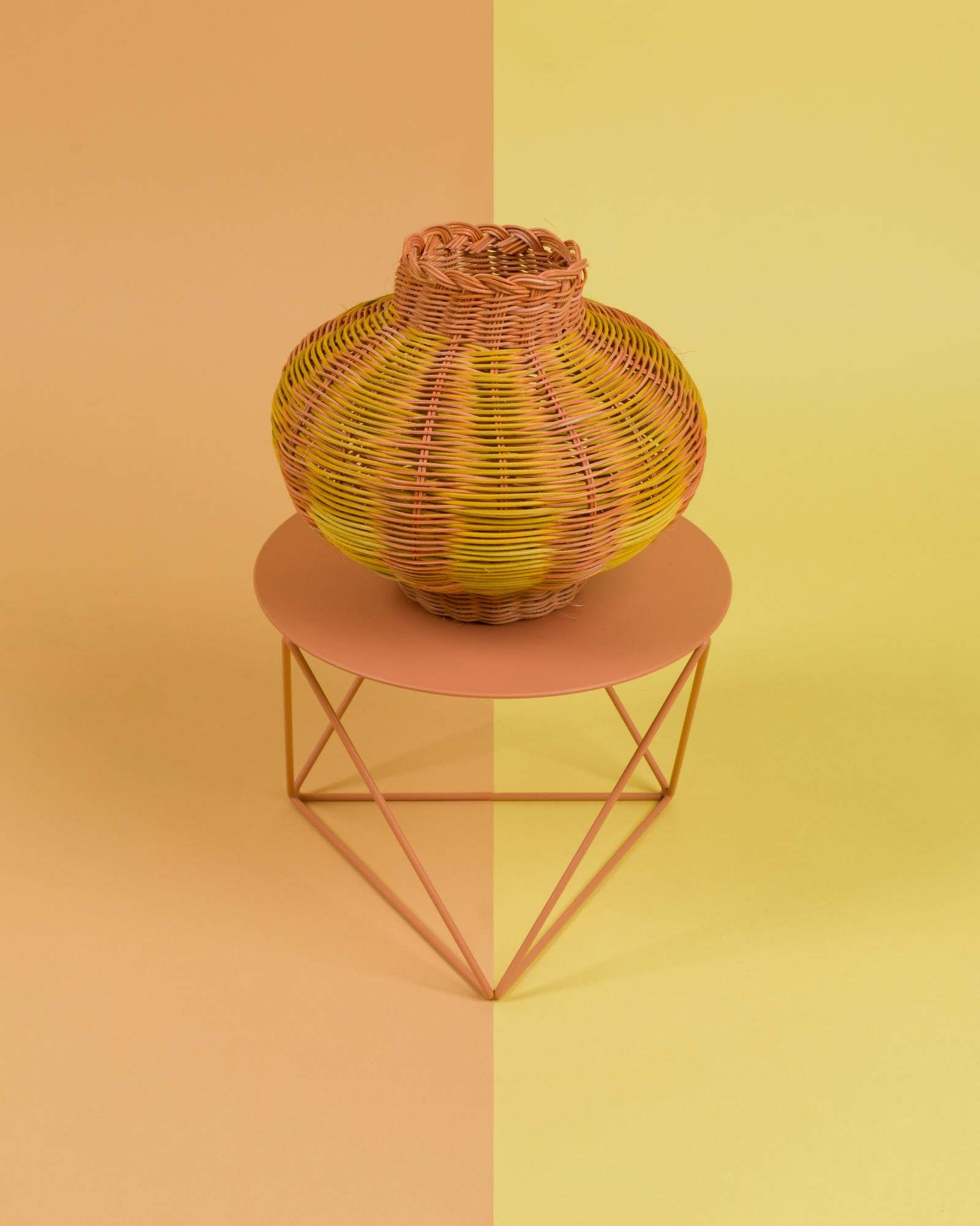 The lantern woven vessel in orange + lemon is a one-of-a-kind objet d’art, hand dyed and woven with reed in our Chicago studio. Inspired by forms in ancient Greek ceramics, the material language of this vessel brings together the rich craft history