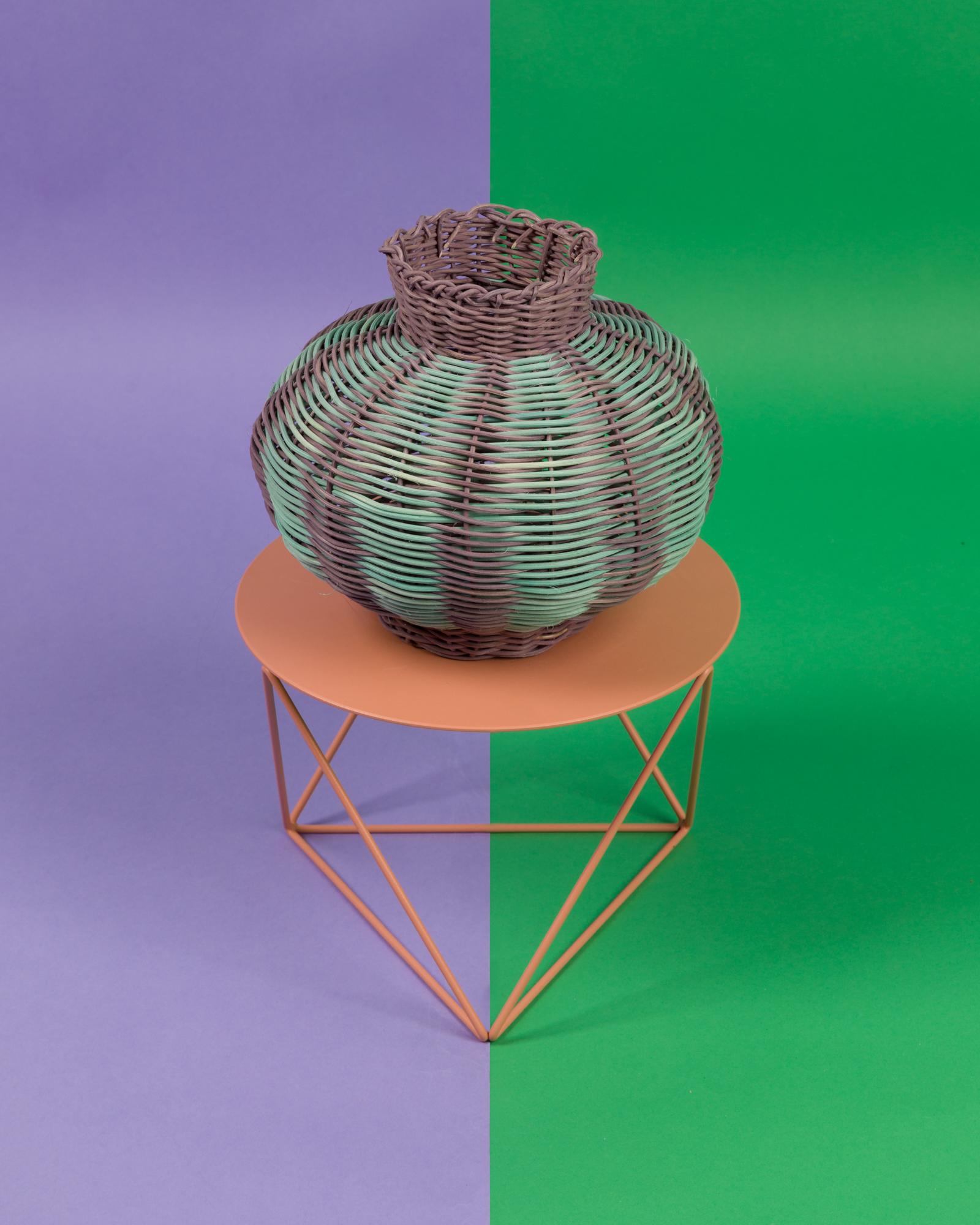 He lantern woven vessel is is a one-of-a-kind objet d’art, hand dyed and woven with reed in our Chicago studio. Inspired by forms in ancient Greek ceramics, the material language of this vessel brings together the rich craft history of weaving with