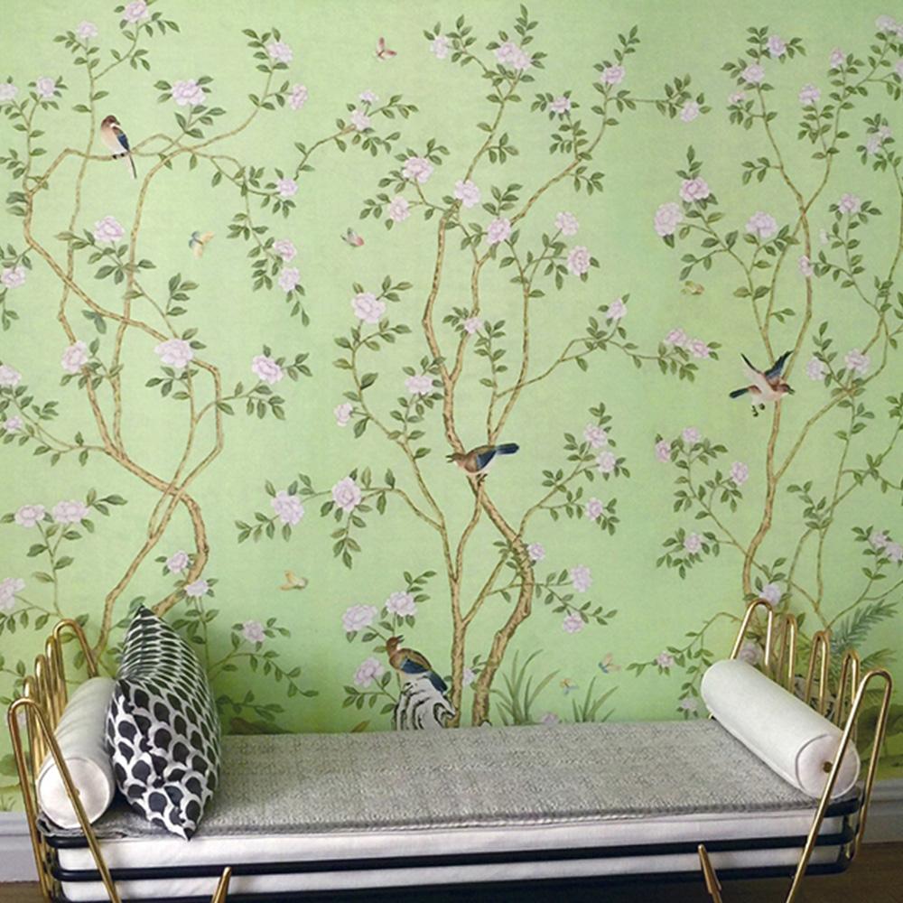 Lantilly Emerald is a beautiful Chinoiserie mural on a striking emerald green background with flying birds and delicate flowers. This mural wallpaper features 3 panels before the pattern repeats. You can use the mural as a 3 panel set, or framed