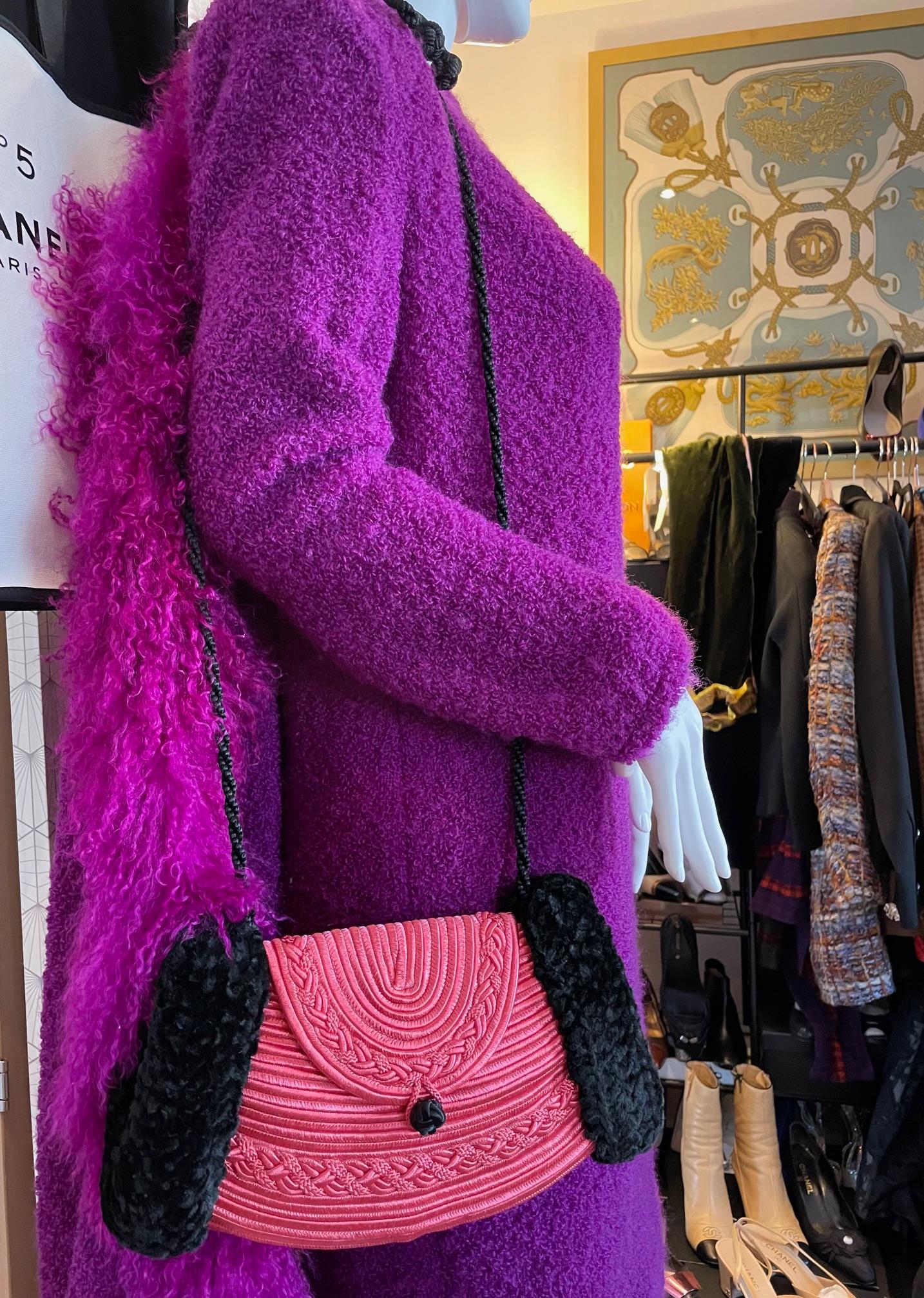 A stunning collector piece from Lanvin. Beautiful pink and black trimmings, Russian style muff with a long shoulder corduroy black cord with tassels.  Large open space on each side to hold your hands, one interior pocket for phone or lipstick...Can
