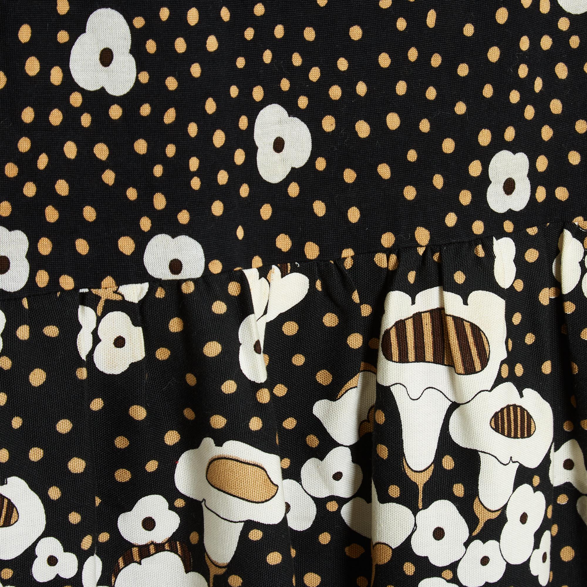 Lanvin dress from the Spring Summer 1972 collection by Jules François Crahay, in cotton jersey (blend) and cotton canvas (blend) printed with beige polka dots, white and colorful flowers and mushrooms, round neck, long sleeves (3/4), bell skirt