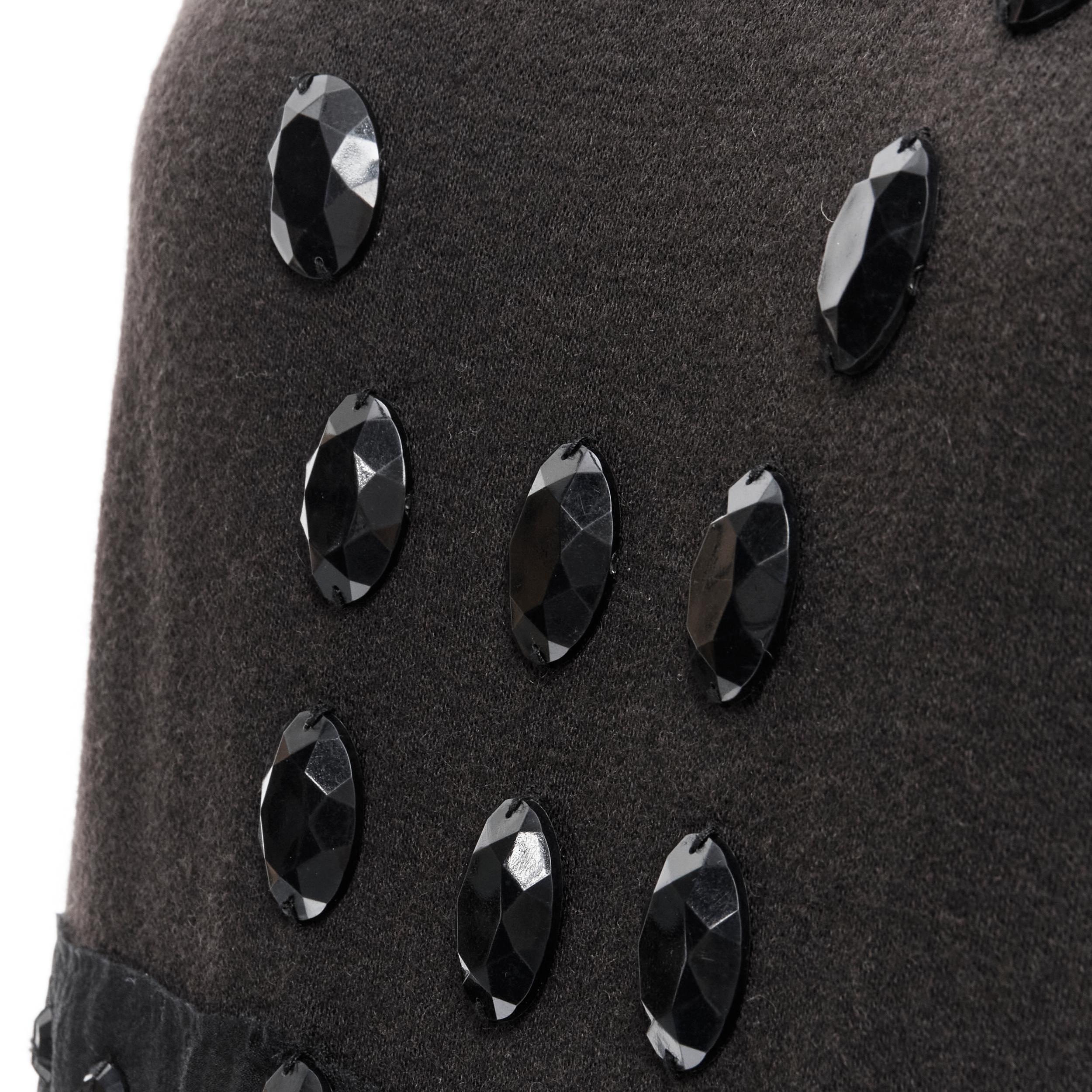 LANVIN 2004 Alber Elbaz brown wool black jewel embellished sheath dress FR38 S 
Reference: CELG/A00115 
Brand: Lanvin 
Designer: Alber Elbaz 
Collection: Fall Winter 2004 
Material: Wool 
Color: Brown 
Pattern: Solid 
Closure: Zip 
Extra Detail: