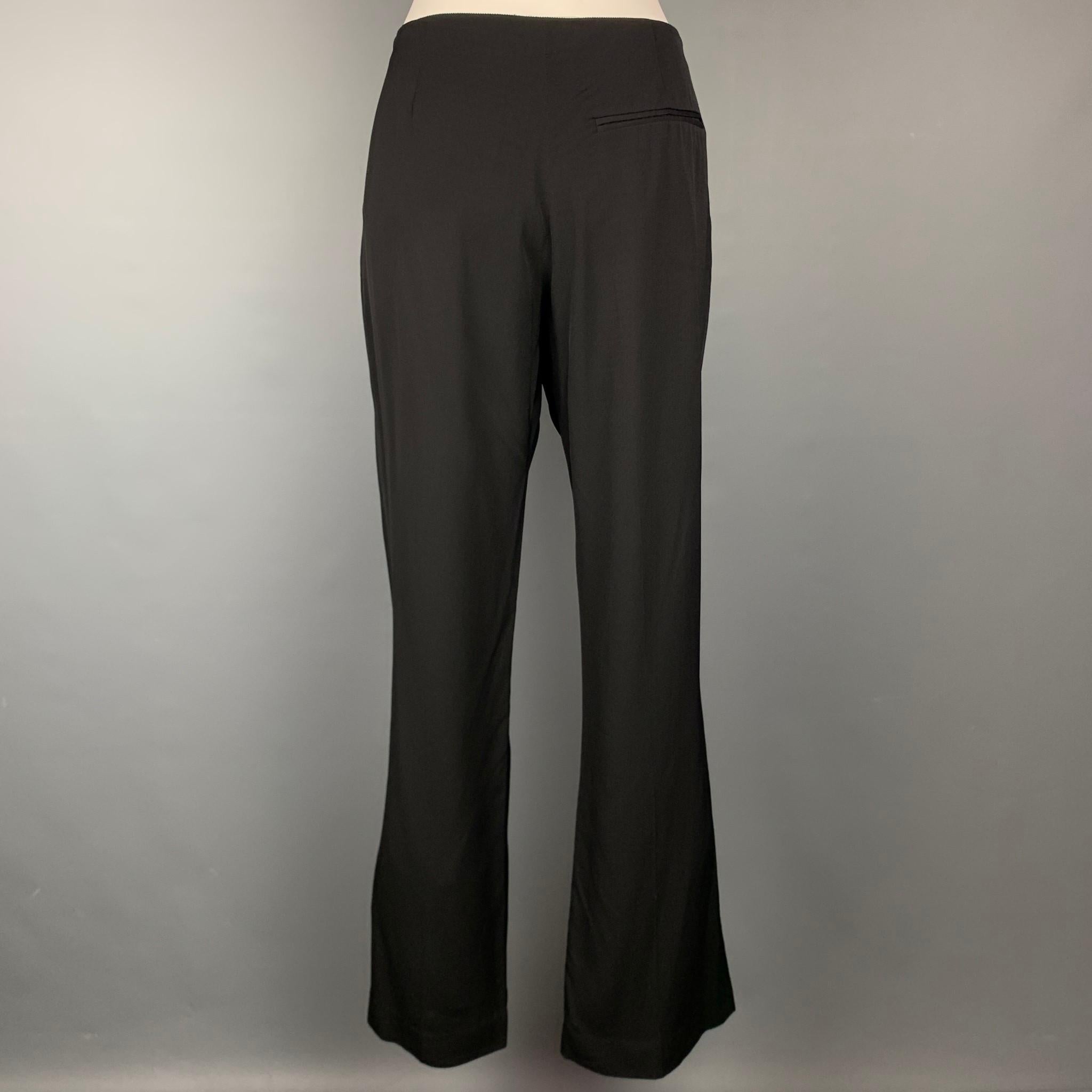 LAVIN 2007 dress pants comes in a black viscose featuring a straight leg, slit pockets, and a zip fly closure. Made in France.

Very Good Pre-Owned Condition.
Marked: 42

Measurements:

Waist: 34 in.
Rise: 8.5 in.
Inseam: 33 in. 