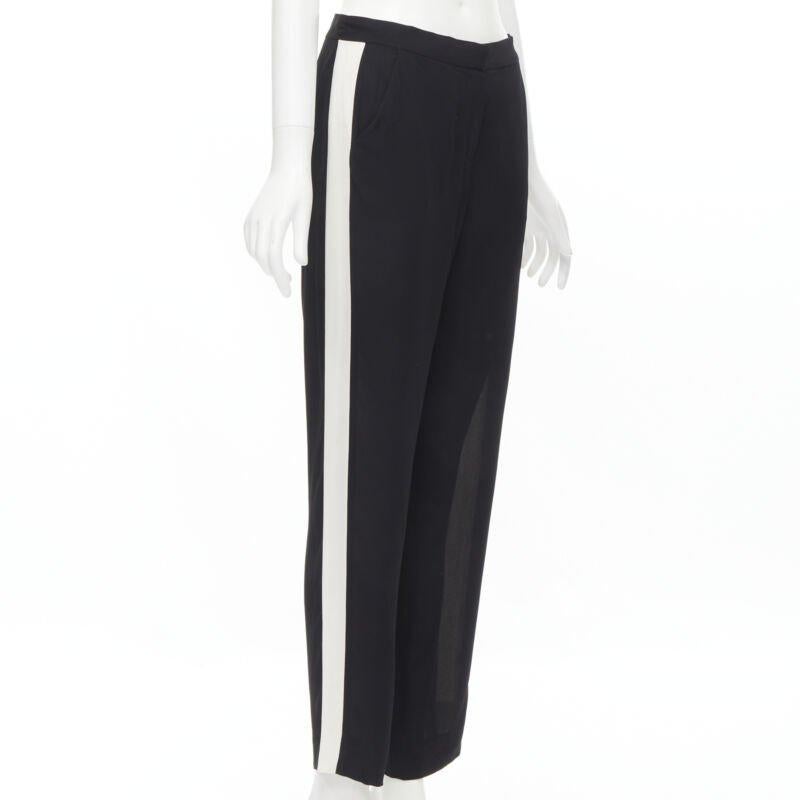 LANVIN 2013 Alber Elbaz 100% viscose white stripe black trousers FR36 S
Reference: MELK/A00074
Brand: Lanvin
Designer: Alber Elbaz
Material: Viscose
Color: Black, White
Pattern: Solid
Closure: Zip
Extra Details: 2 side pocekts. Straight leg.
Made