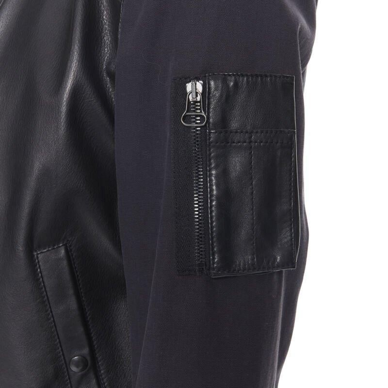 LANVIN ALBER ELBAZ black contrast lamb leather front MA1 bomber jacket EU44 XS
Reference: CRTI/A00270
Brand: Lanvin
Designer: Alber Elbaz
Model: Leather bomber
Material: Leather, Cotton
Color: Black
Pattern: Solid
Closure: Zip
Extra Details: Calf