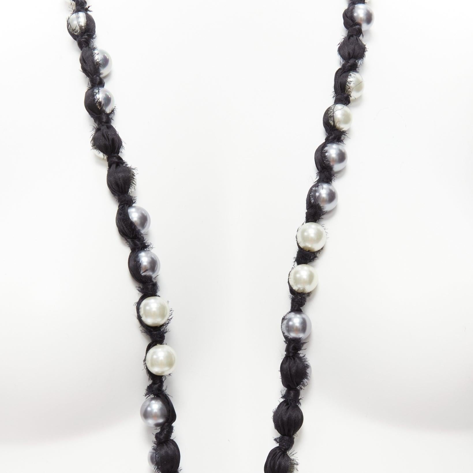 LANVIN ALBER ELBAZ cream charcoal black pearl silk ribbon wrapped long necklace
Reference: SNKO/A00337
Brand: Lanvin
Designer: Alber Elbaz
Material: Faux Pearl, Fabric
Color: Pearl, Black
Pattern: Solid
Closure: Self Tie

CONDITION:
Condition: