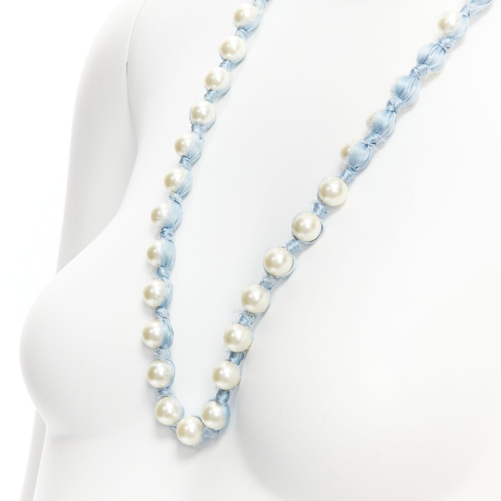 LANVIN ALBER ELBAZ cream pearl blue silk ribbon wrap long necklace
Reference: SNKO/A00340
Brand: Lanvin
Designer: Alber Elbaz
Material: Faux Pearl, Silk
Color: Blue, Pearl
Pattern: Solid
Closure: Self Tie

CONDITION:
Condition: Excellent, this item