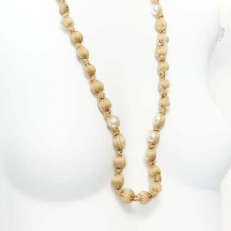 LANVIN ALBER ELBAZ gold silk ribbon cream pearl wrap long necklace
Reference: SNKO/A00341
Brand: Lanvin
Designer: Alber Elbaz
Material: Silk, Faux Pearl
Color: Pearl, Gold
Pattern: Solid
Closure: Self Tie

CONDITION:
Condition: Excellent, this item