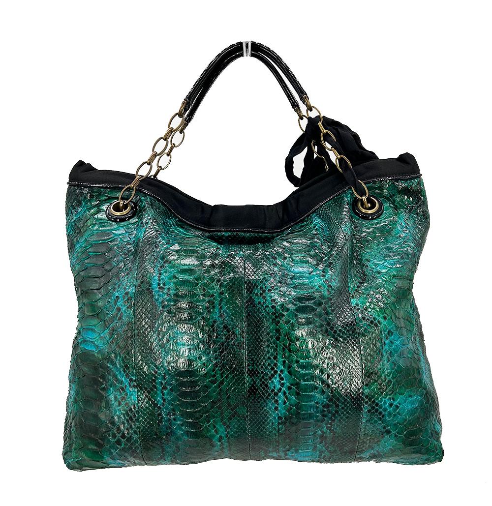Lanvin Amalia Python Tote in excellent condition. Teal green python exterior trimmed with black patent leather, black satin piping and bronze hardware. Signature silver coin charm detail with gold hardware on front end of shoulder strap can easily