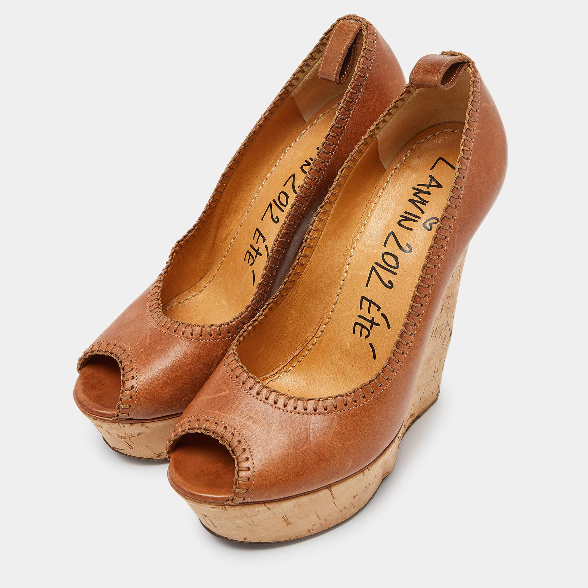 Any fashionable closet is incomplete without a pair of pumps. These lovely pumps from Lanvin are a versatile pair that will complement both your work and off duty outfits. Crafted with leather they feature an elegant design. These beauties are