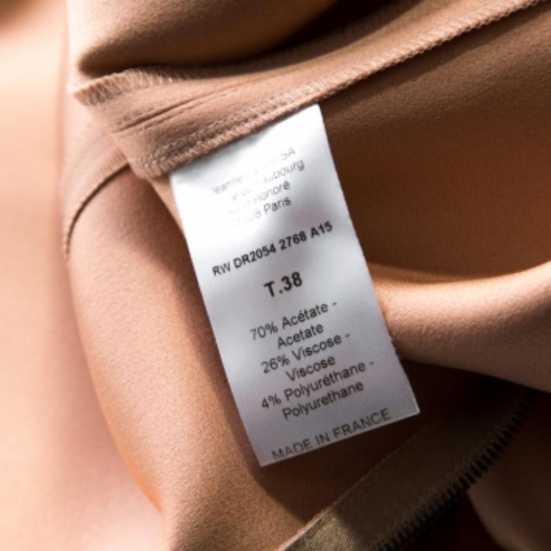 A Lanvin dress like this is an elegant piece that will lend an edge to your collection. Make a classy impression to your wardrobe with this beautiful beige sheath dress that has been made from stretch wool in a sleeveless style.