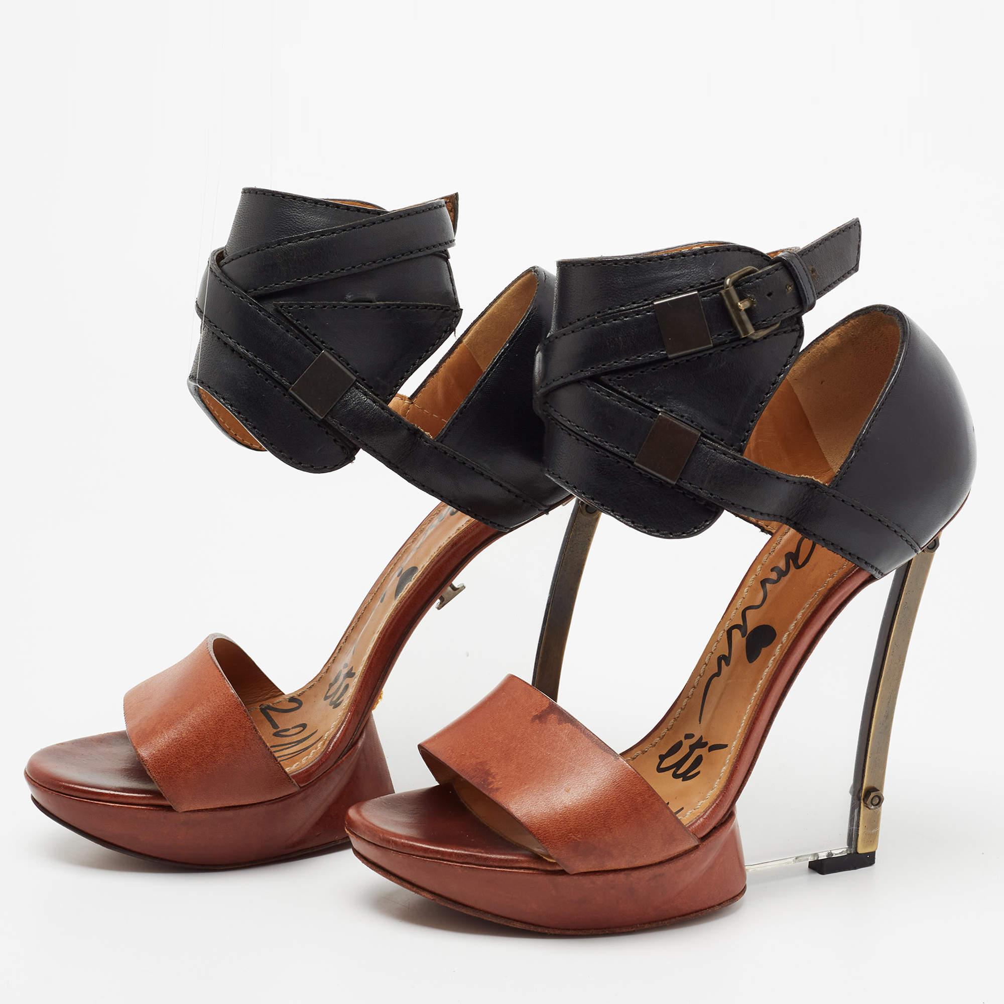 These stunning sandals by Lanvin are designed to elevate your look instantly. They are crafted from leather and designed with open toes, cuff-like ankle straps, and transparent wedge heels. An artistic pair that is worth the buy.

