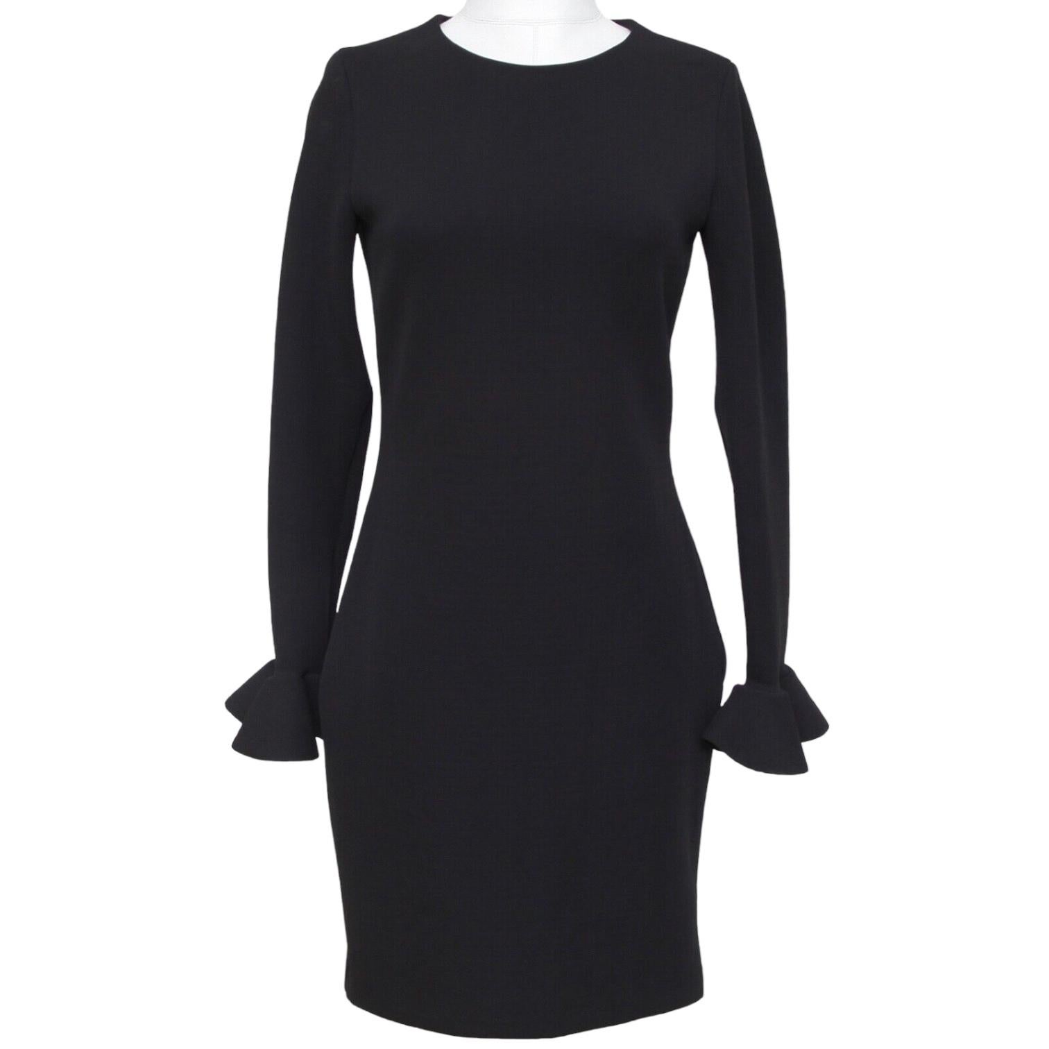 GARANTIZADO AUTENTICO VERANO 2015 LANVIN VESTIDO NEGRO MANGA LARGA

Cómodo de llevar Buena elasticidad del material

Diseño:
 - Vestido negro de manga larga.
 - Cuello redondo.
 - Puño con volante.
 - Cierre trasero de cremallera.

Material: 51%