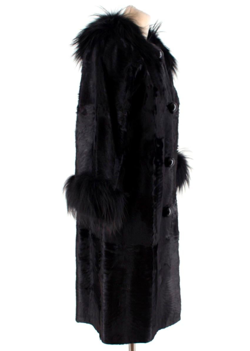 Lanvin Black Lambs Fur Long Coat With Fox Fur Trim.

- Shiny, smooth & soft fur coat
- Overside leather covered buttons 
- Button fastening 
- Fox fur cuffs & collar
- Jersey lining 
- Side pockets
Please note, these items are pre-owned and may show