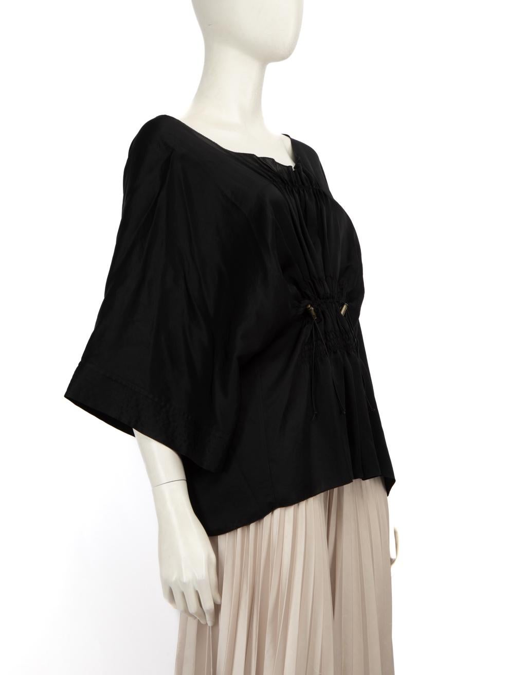 CONDITION is Very good. Minimal wear to the blouse is evident. Small hole to the designer logo label on the inner back neck. Pulls to the weave on the front left by the neckline, under the left and right armpit and on the front right sleeve. Marks