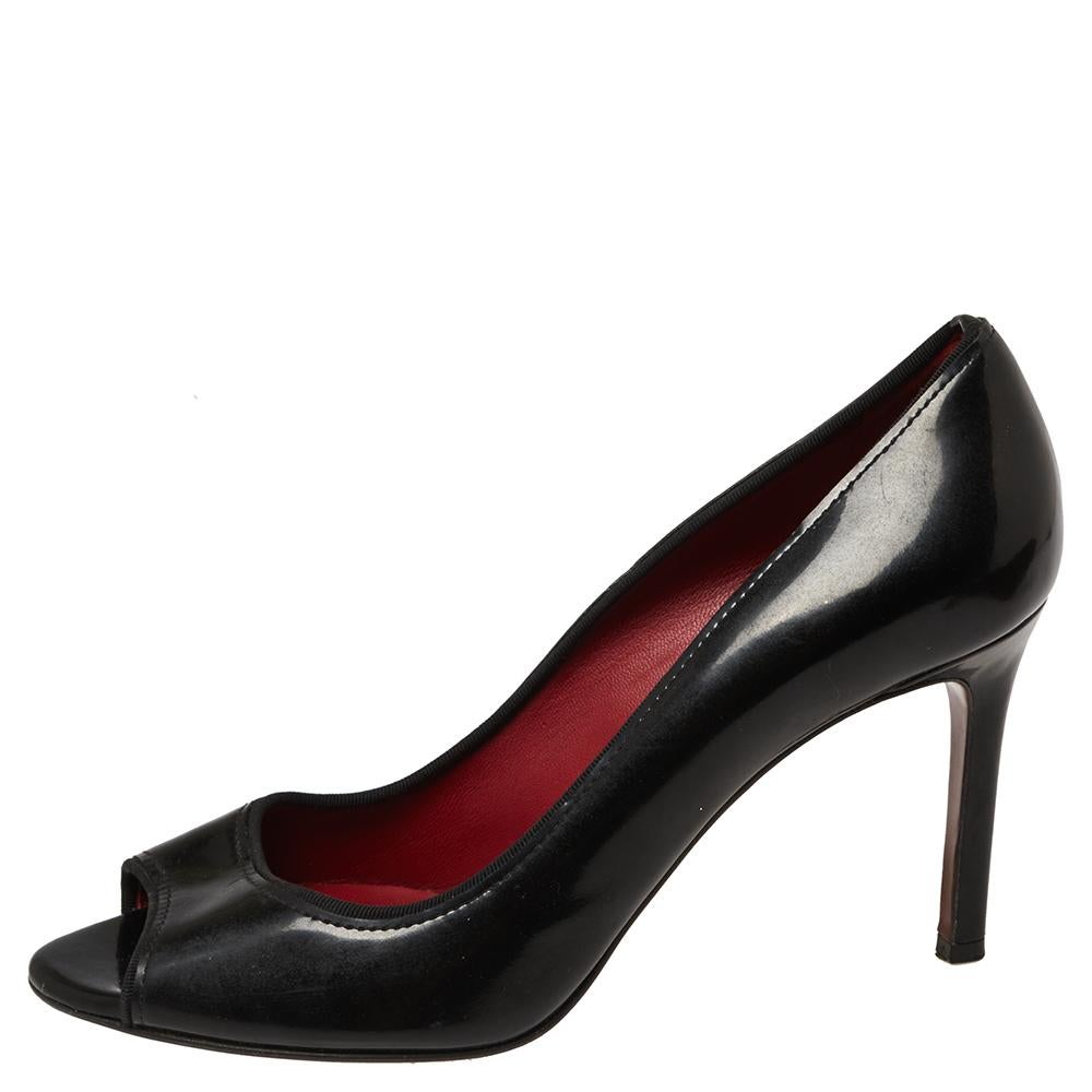 Grace and poise will all come naturally to you when you step out in this pair of black pumps from Lanvin. Crafted from patent leather, the open-toe pumps have been endowed with comfortable leather insoles and elevated on 9 cm heels.

