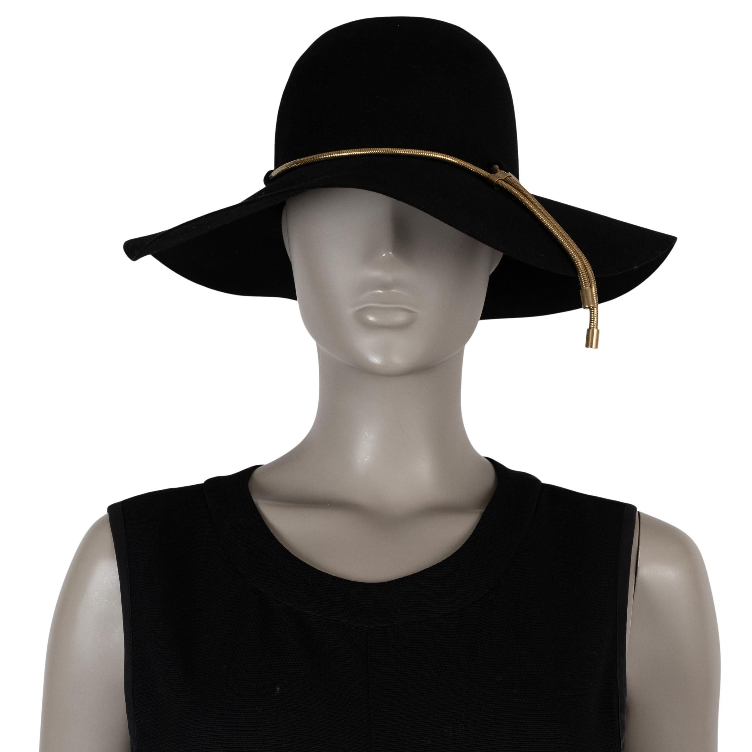 This 100% authentic Lanvin hat is crafted in black rabbit (90%) and hare (10%) felt. It features a wide brim silhouette, elegantly finished with a gold-tone snake chain trim for a refined accent. The interior is lined in viscose (60%) and cotton
