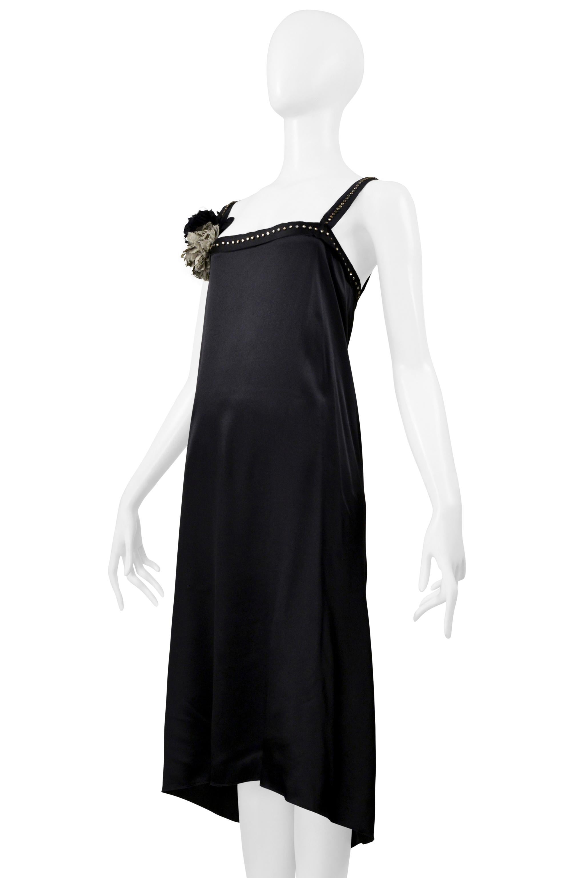 Resurrection Vintage is thrilled to present a vintage Lanvin by Alber Elbaz black satin disco dress. It features an easy body, rhinestone studded yoke band and straps, raw edges, black and grey flowers, a high-low hem, and draping at the center