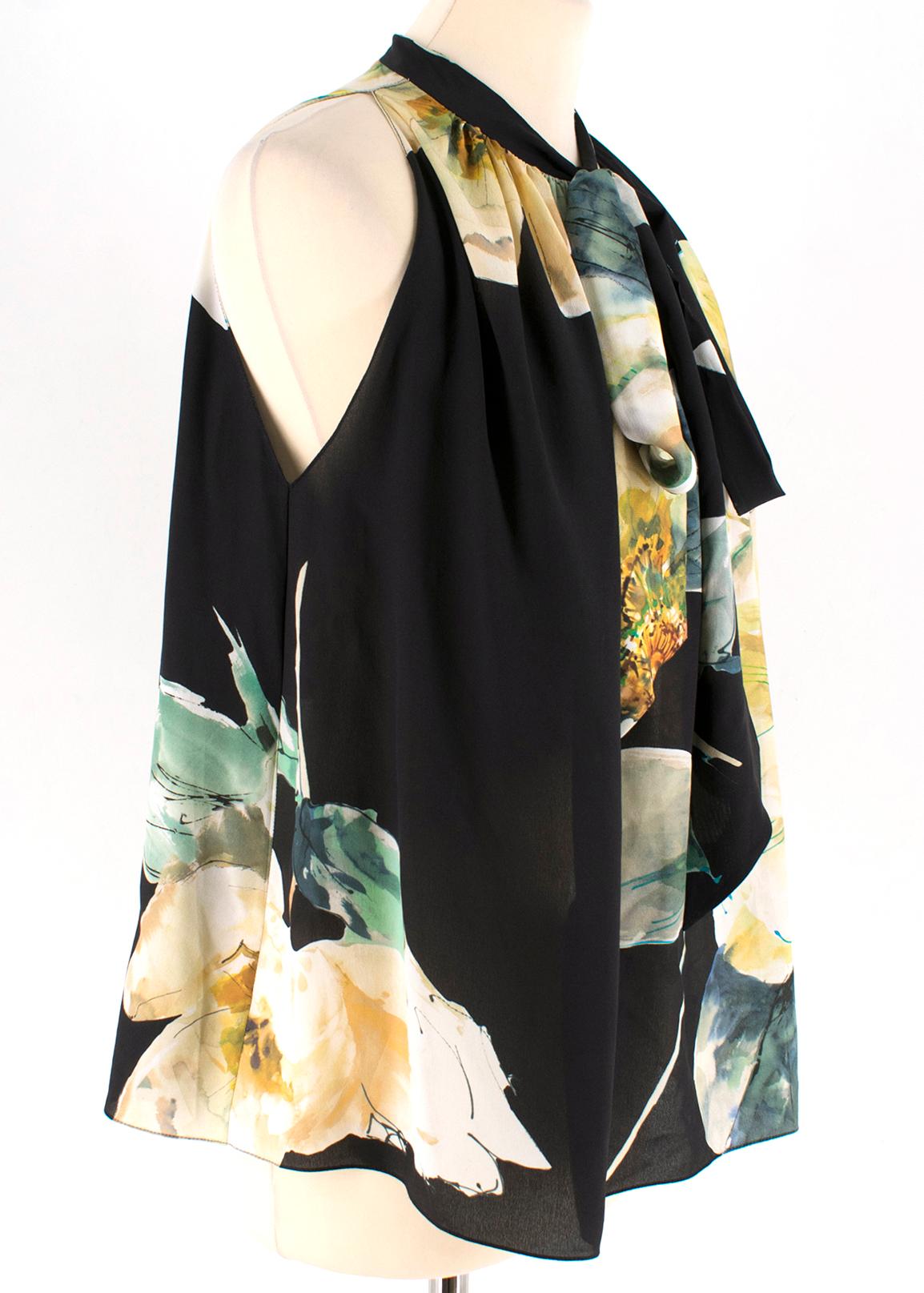 Lanvin Black Silk Floral Sleeveless Top

- silk top
- halterneck style
- relaxed fit
- sleeveless
- lightweight
- bow embellishment to the neck line

Please note, these items are pre-owned and may show some signs of storage, even when unworn and