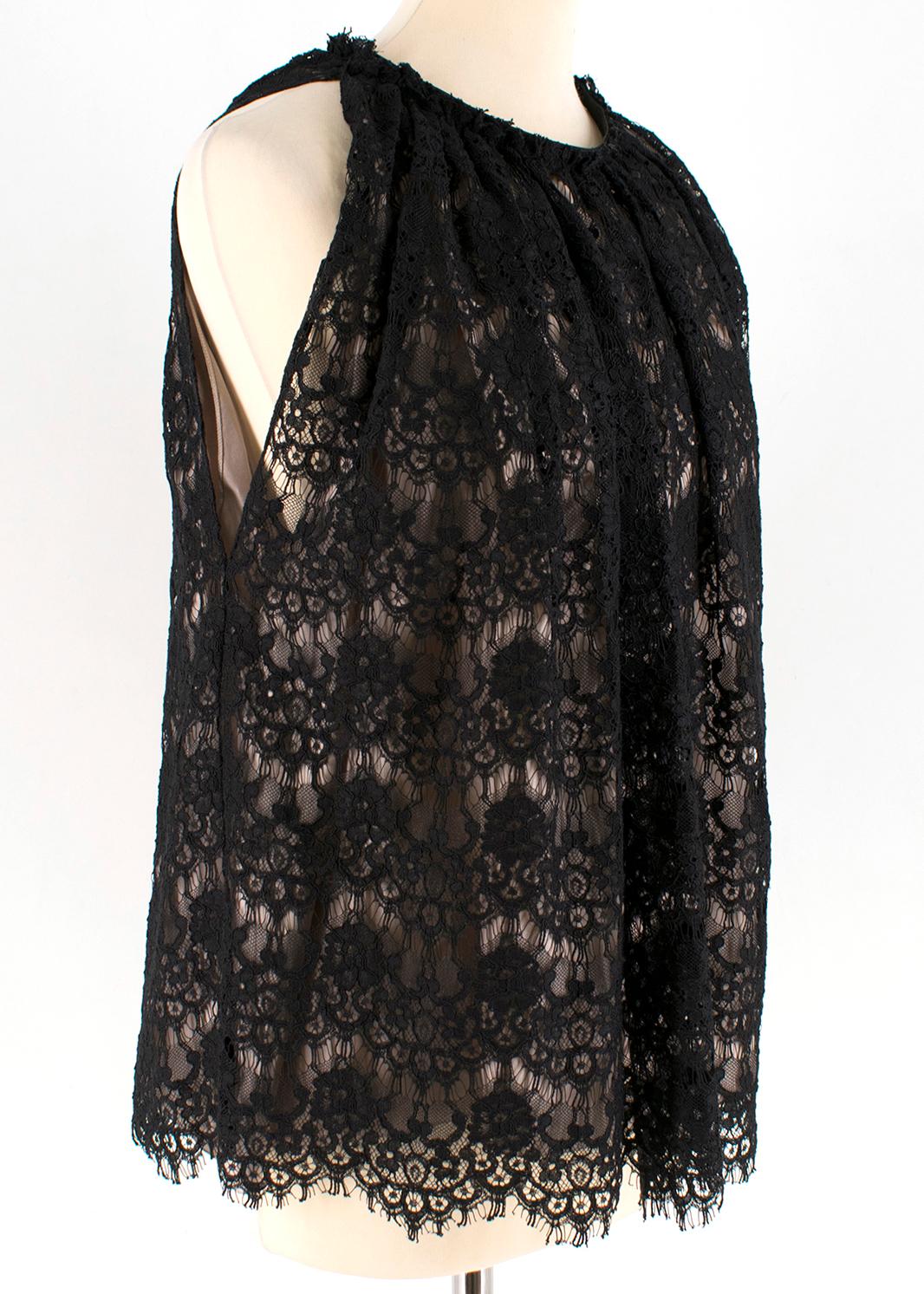Lanvin Black Silk Lace Embellished Sleeveless Top

- layered black lace top 
- halterneck style 
- sleeveless
- silk lined
- hook fastening to the neck side

Please note, these items are pre-owned and may show some signs of storage, even when unworn