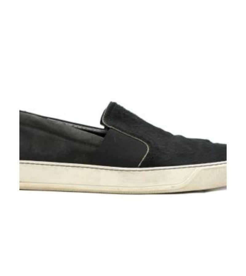 Lanvin Black Textured Calf-Hair Slip-On Trainer .

- Soft calf hair trainers
- White rubber soles
- Nubuck leather

Please note, these items are pre-owned and may show some signs of storage, even when unworn and unused. This is reflected within the