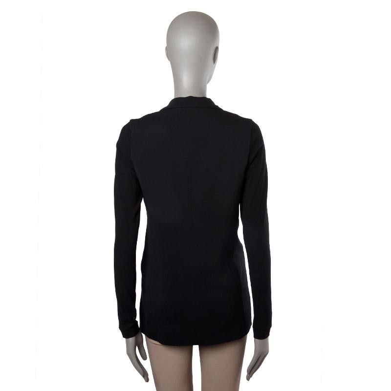 100% authentic Lanvin peak-collar blazer in black viscose (3% elastane) and sleeves in black wool (86%), nylon (9%) and elastane (5%). Opens with two front buttons. Lined in black viscose (52%) and cotton (48%). Has been worn and is in excellent